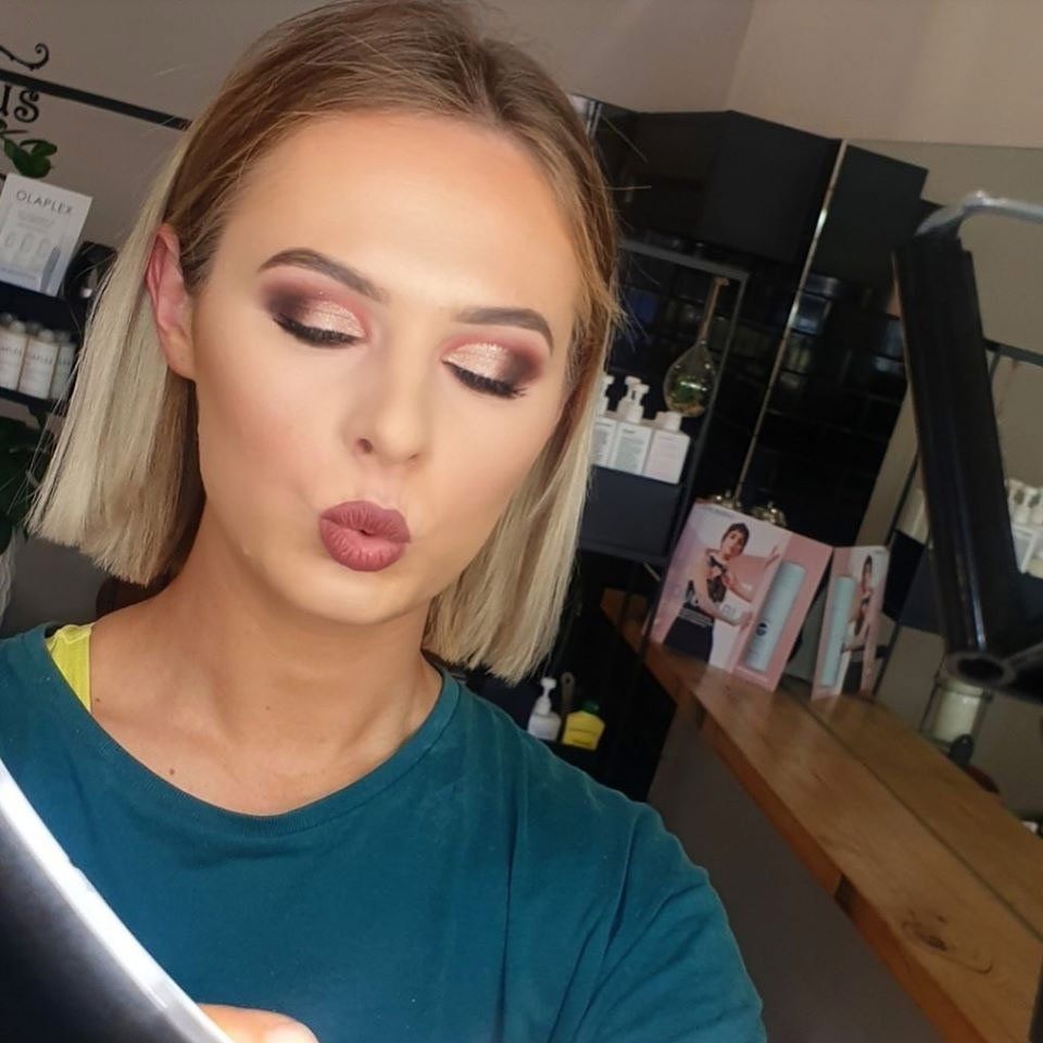 woman with makeup kiss face