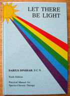 A book titled let there be light has a rainbow on the cover