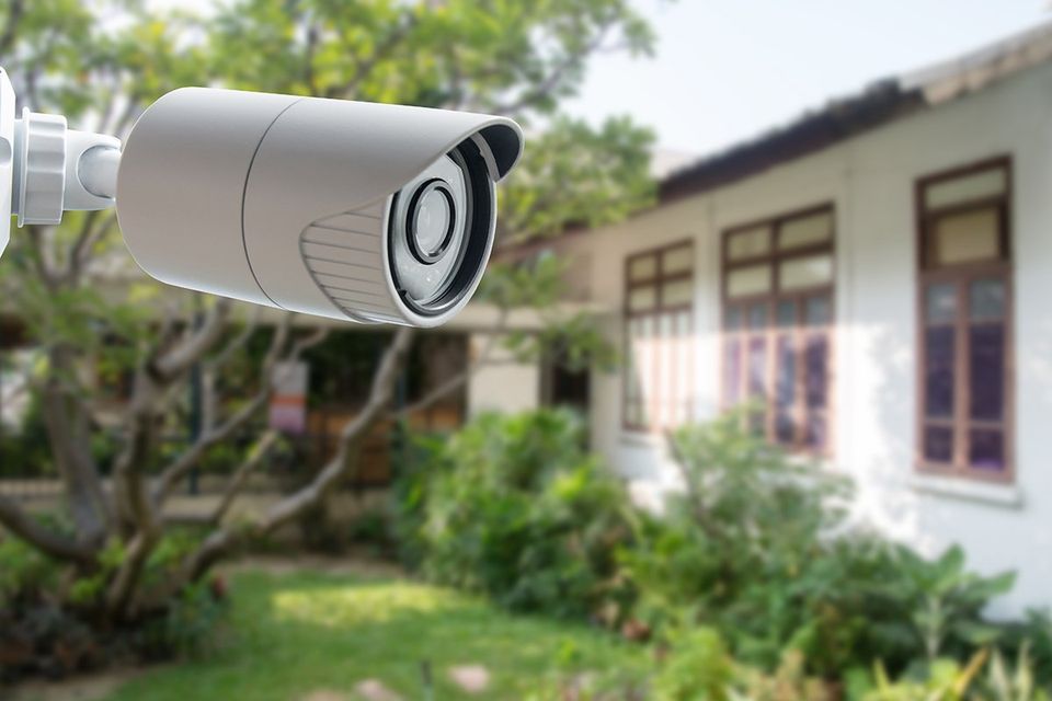 Security system camera outside residential home