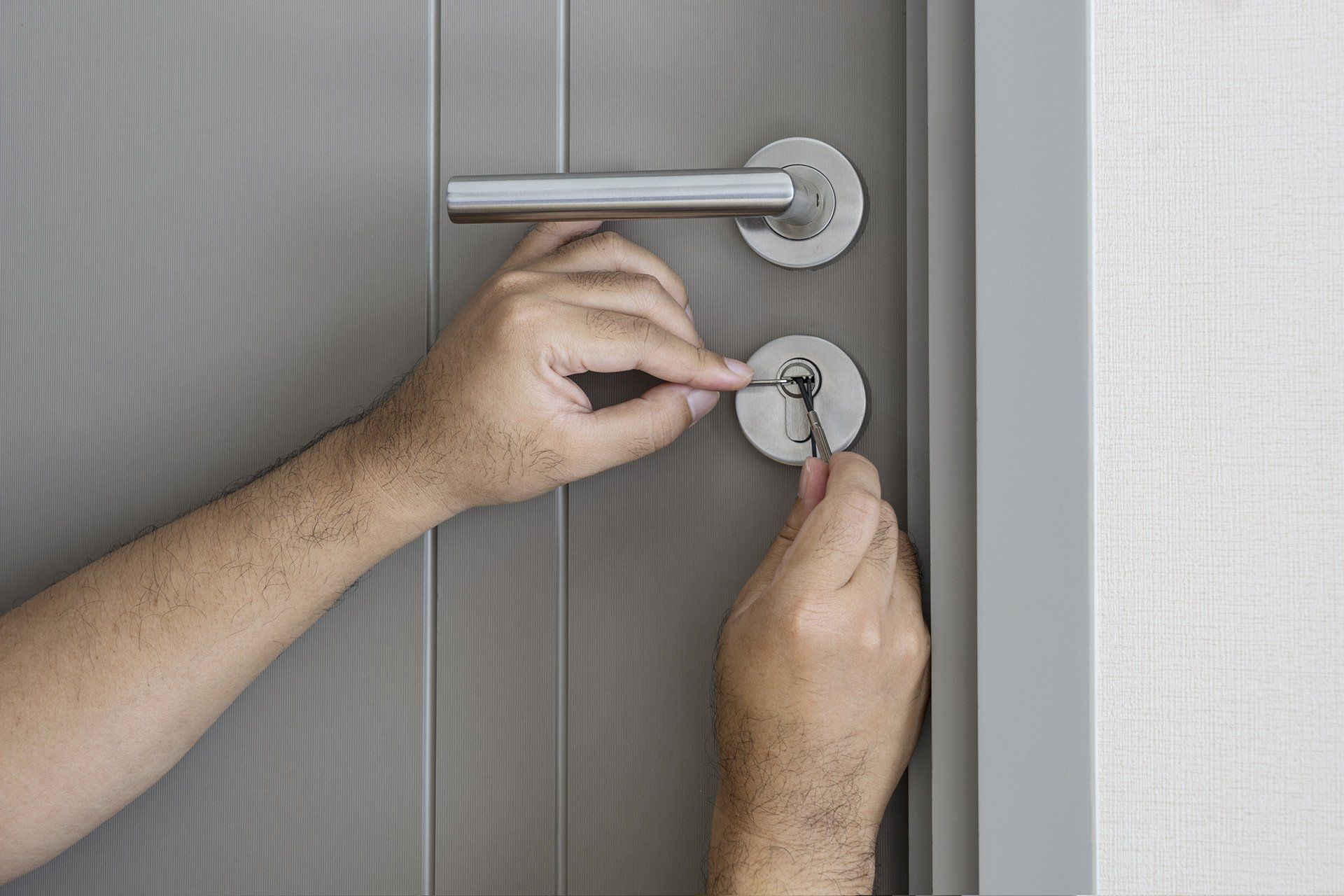 hands picking a lock