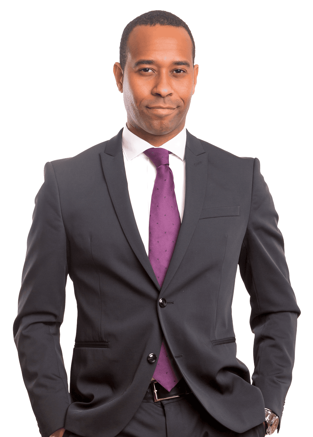 A professional in a dark suit, white shirt, and purple tie, standing against a white background with hands in pockets.