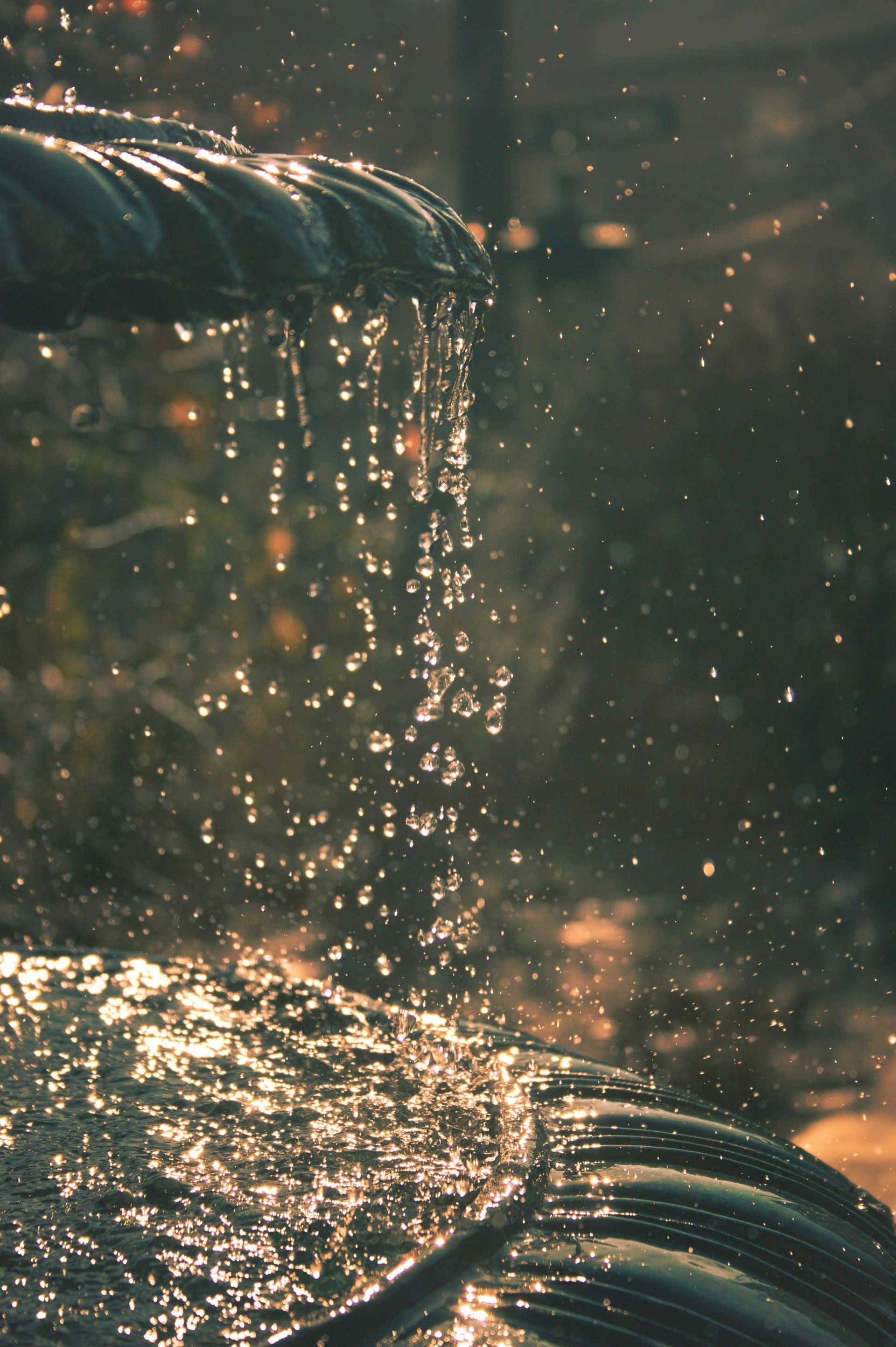 A close up of a fountain with water coming out of it