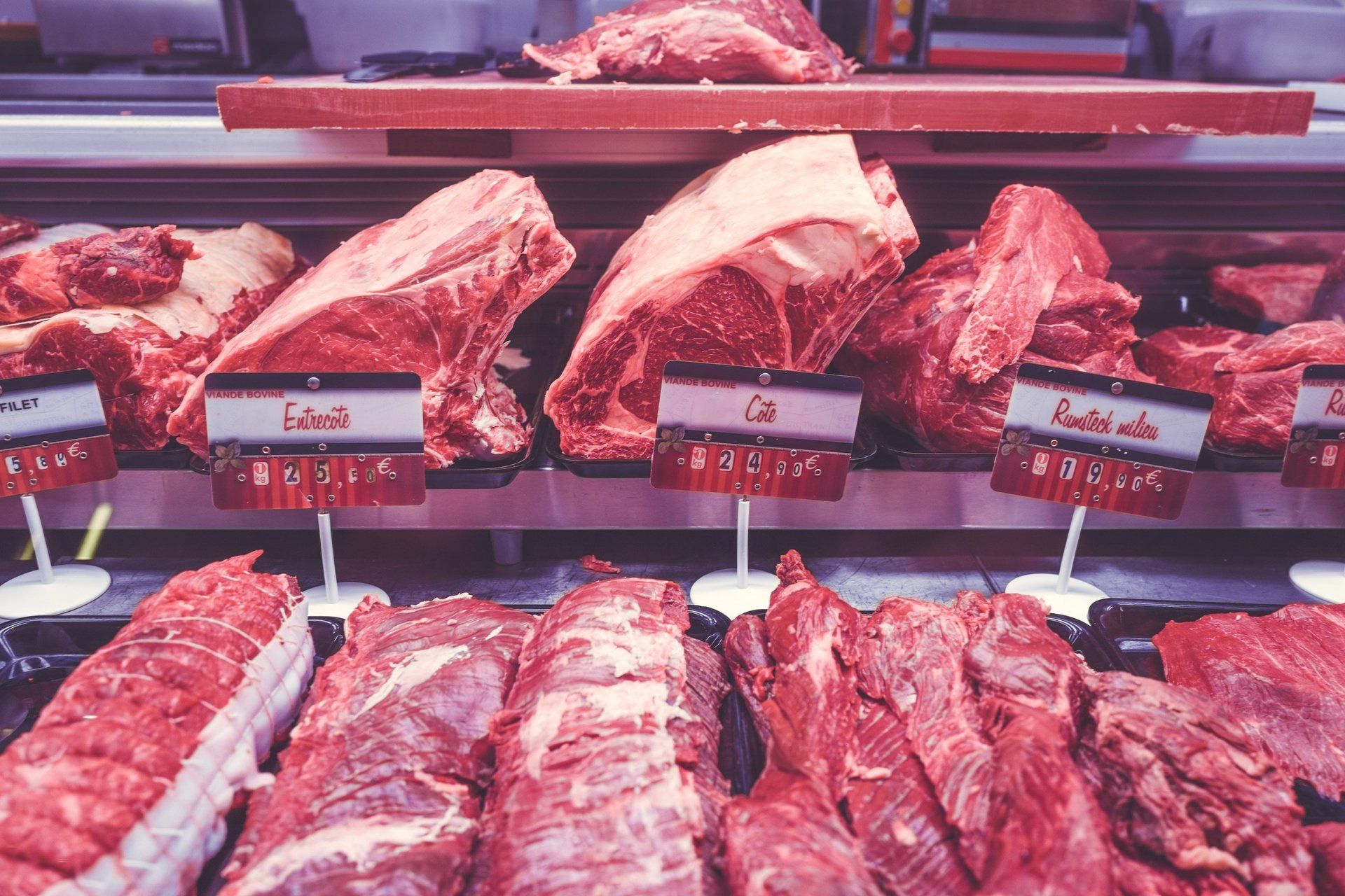 A display case filled with lots of different types of meat.