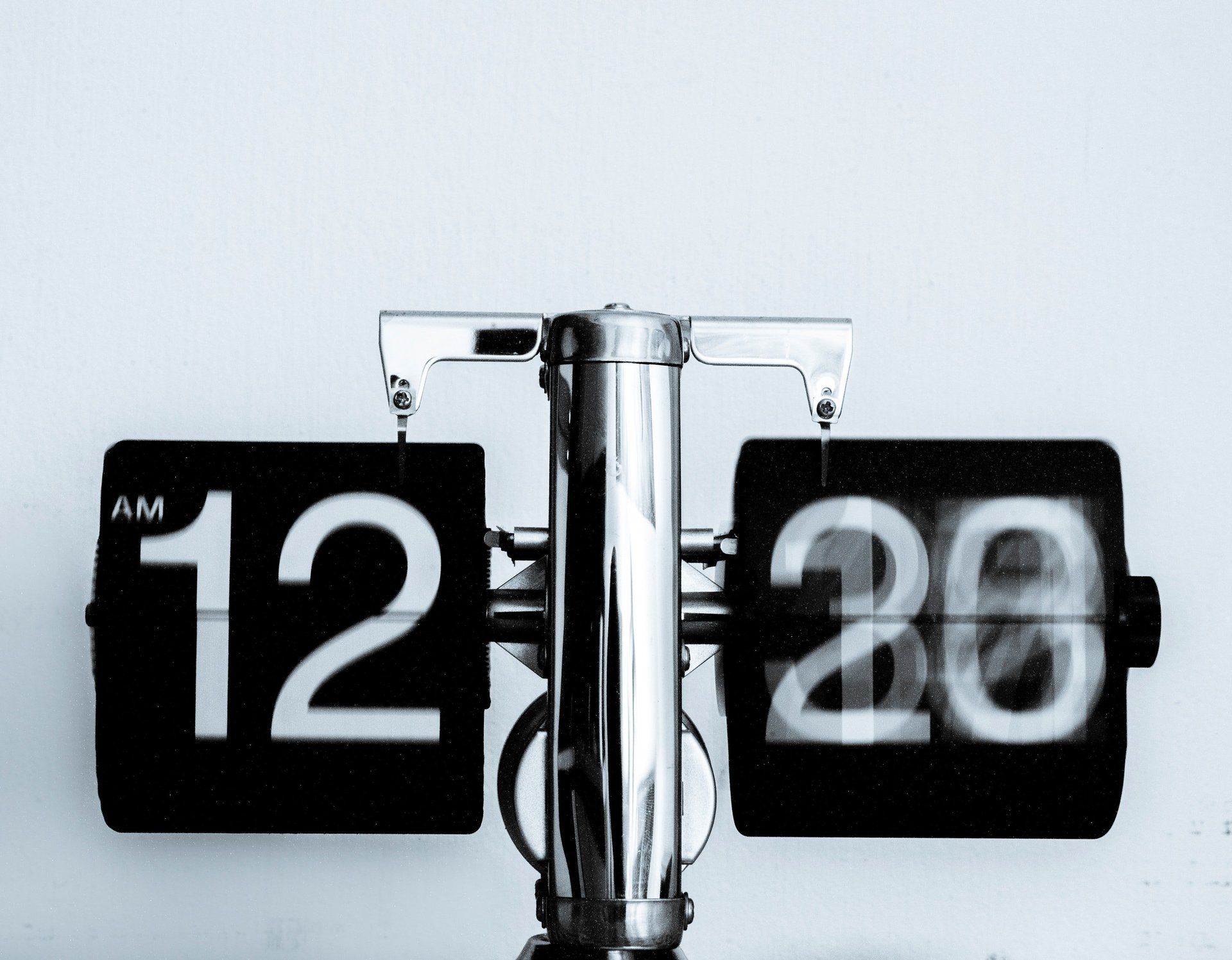 A black and white flip clock shows the time as 12:26