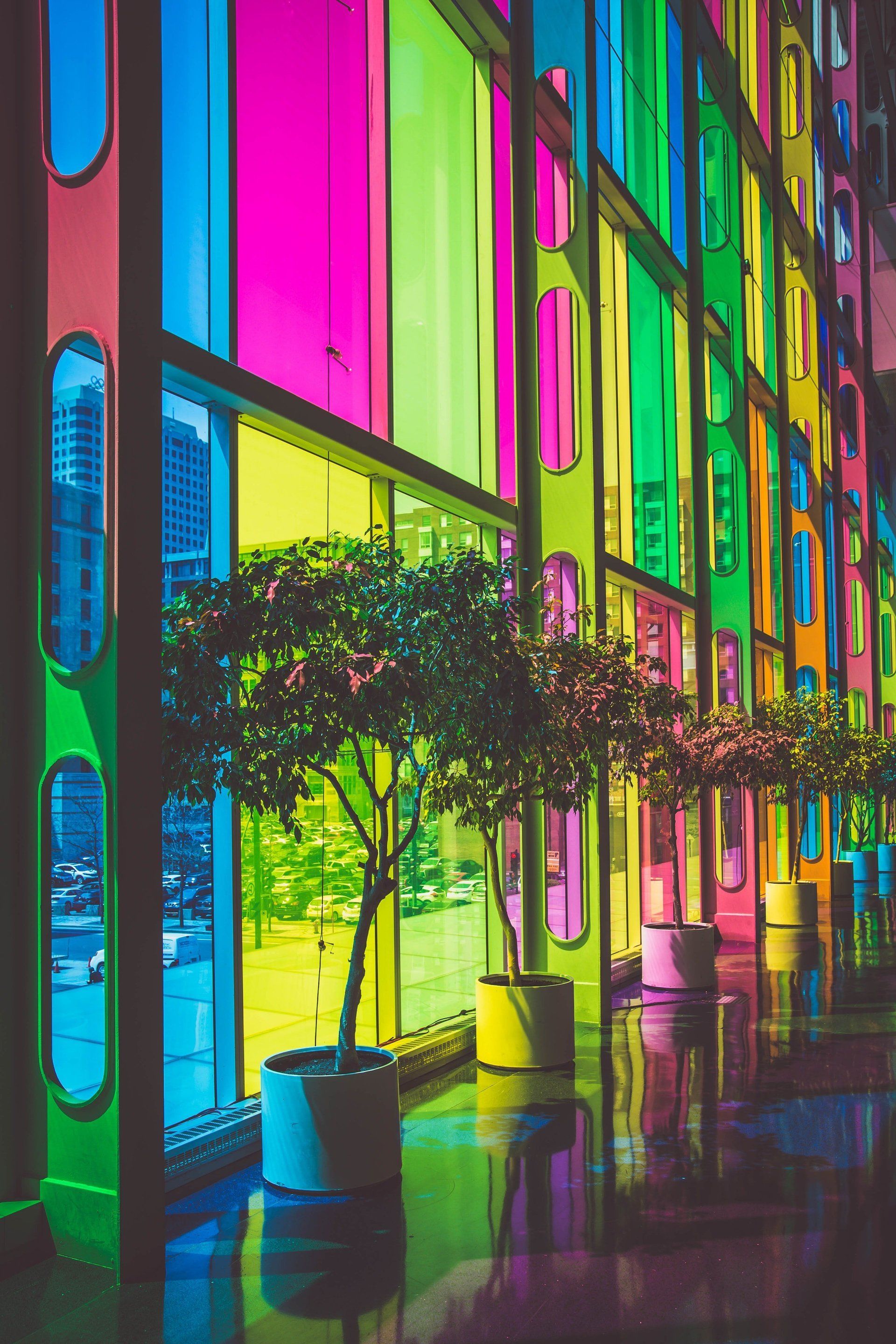Inside of a building with colorful stained glass panels