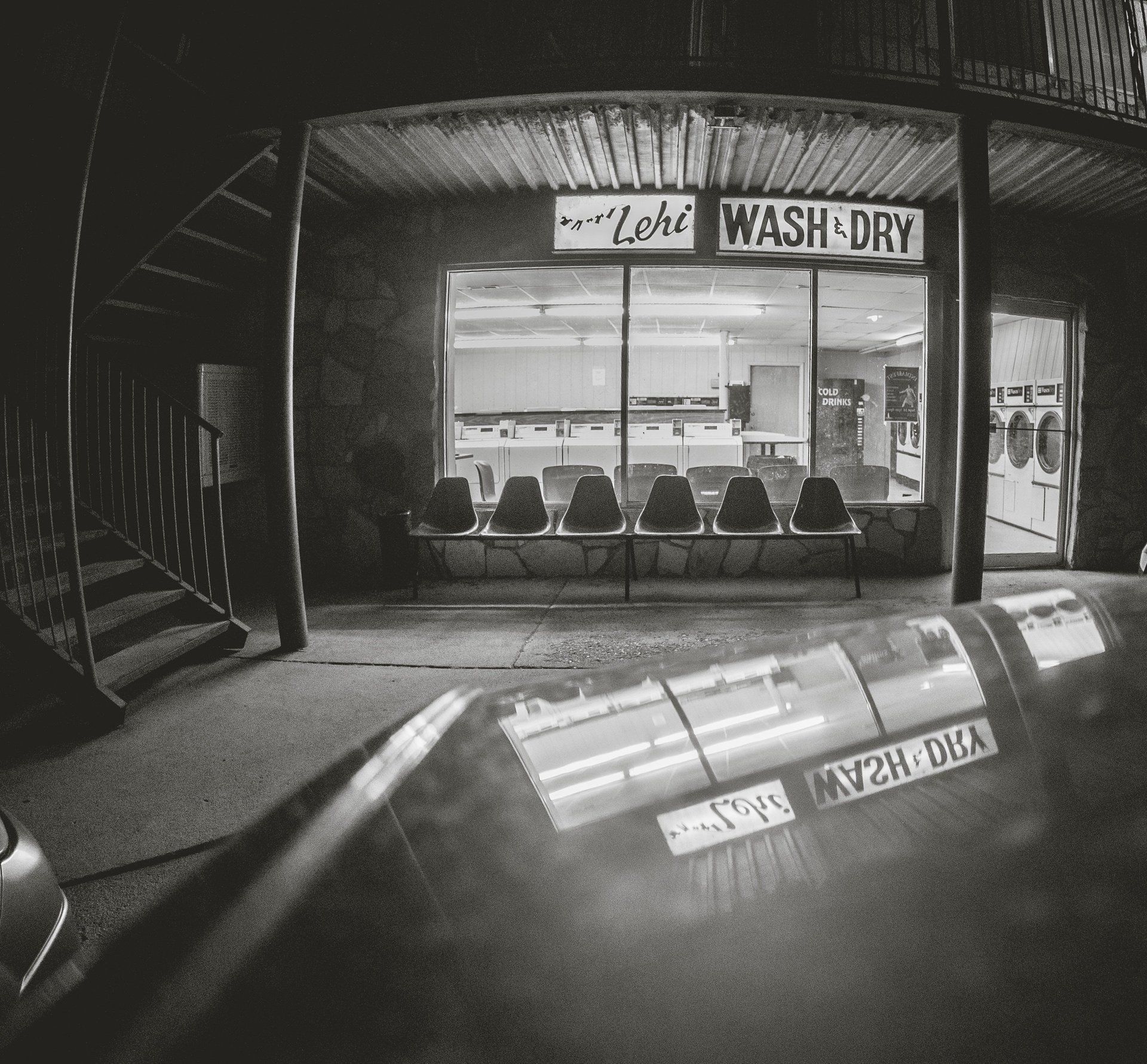 A black and white photo of a laundromat called lehi