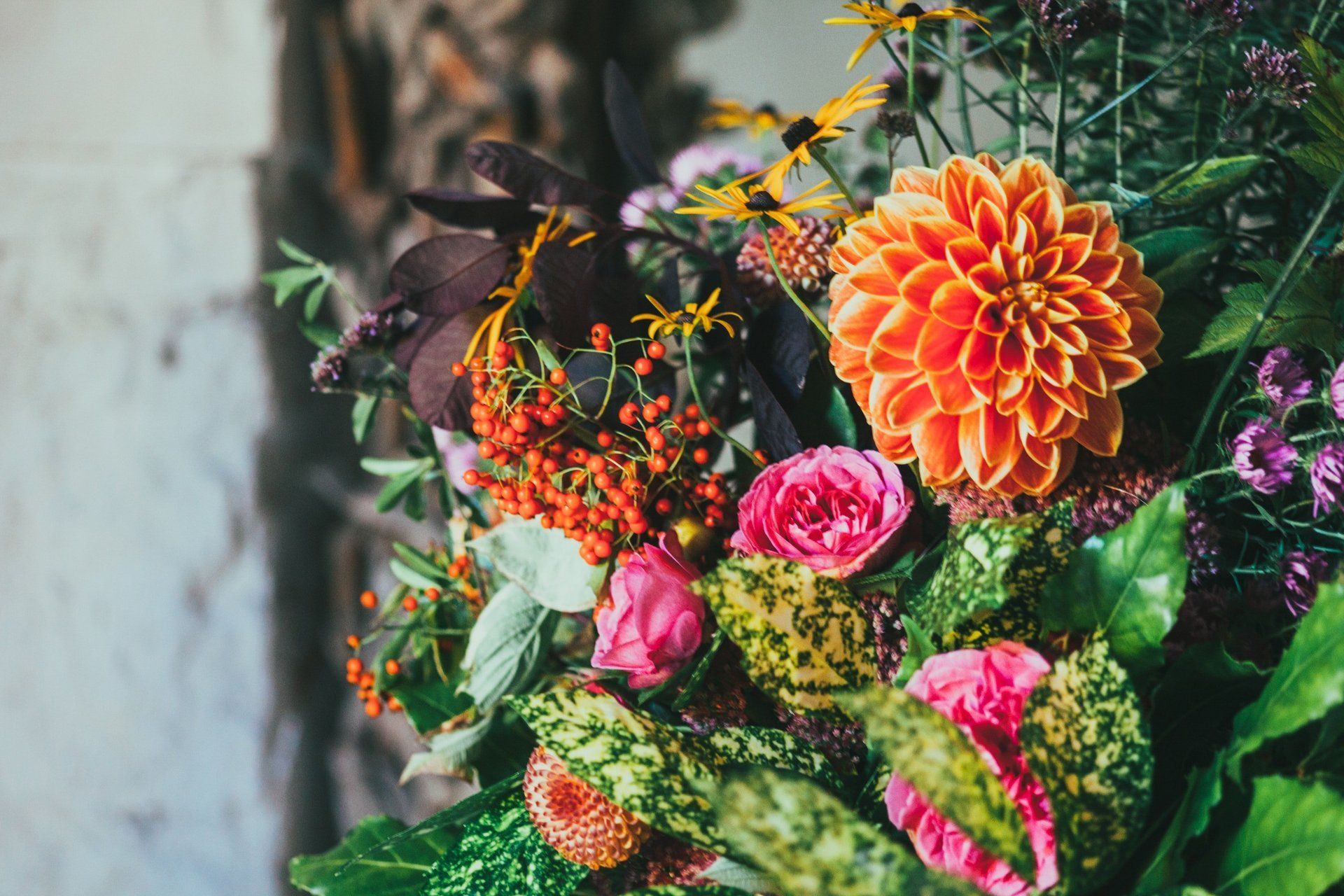 A close up of a bouquet of flowers on a table.