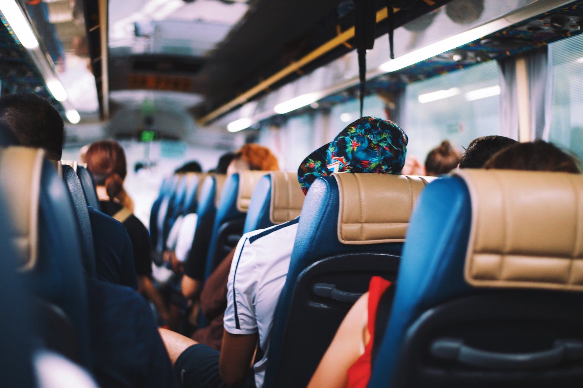 A group of people are sitting on a bus.