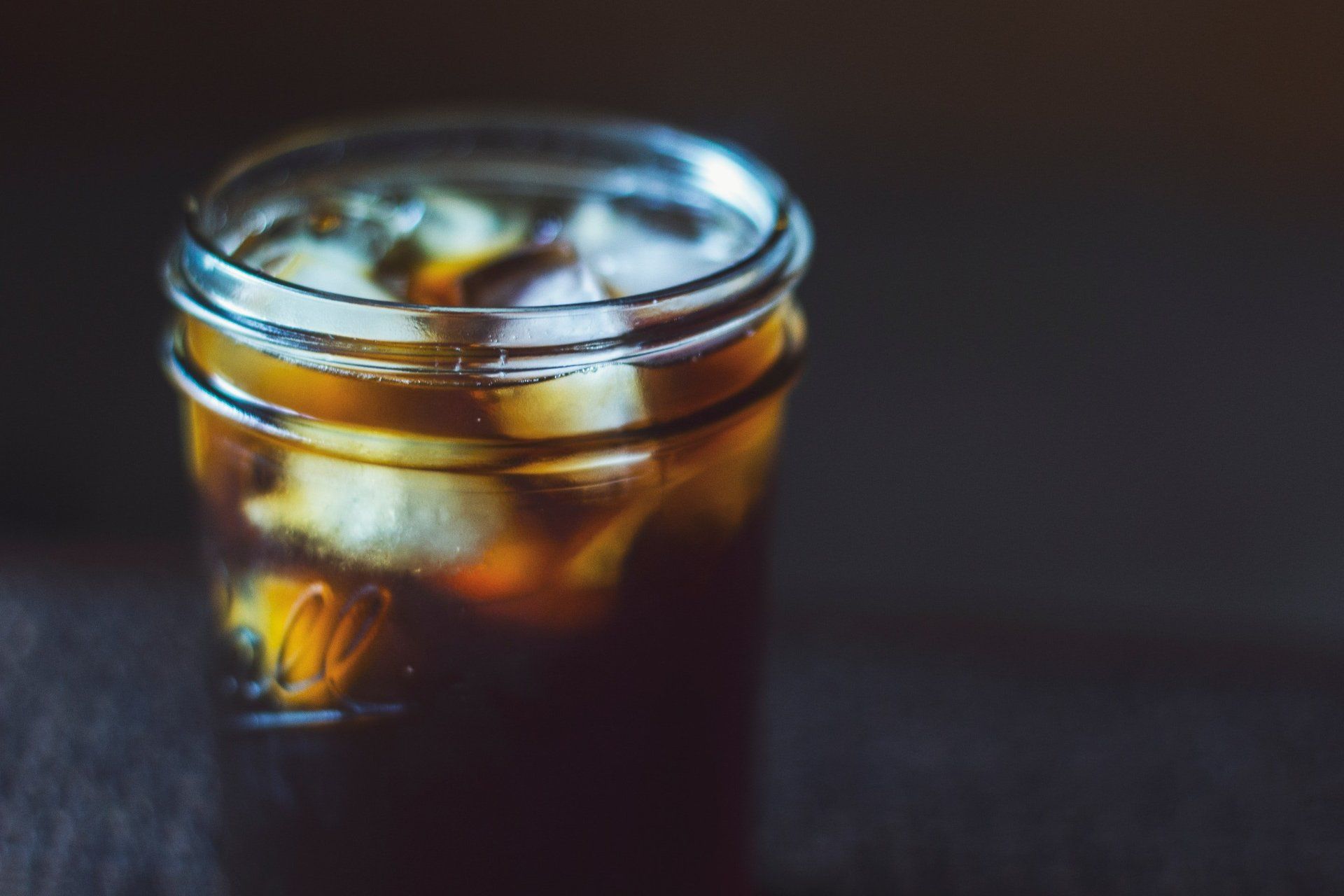 A dark iced beverage in a
