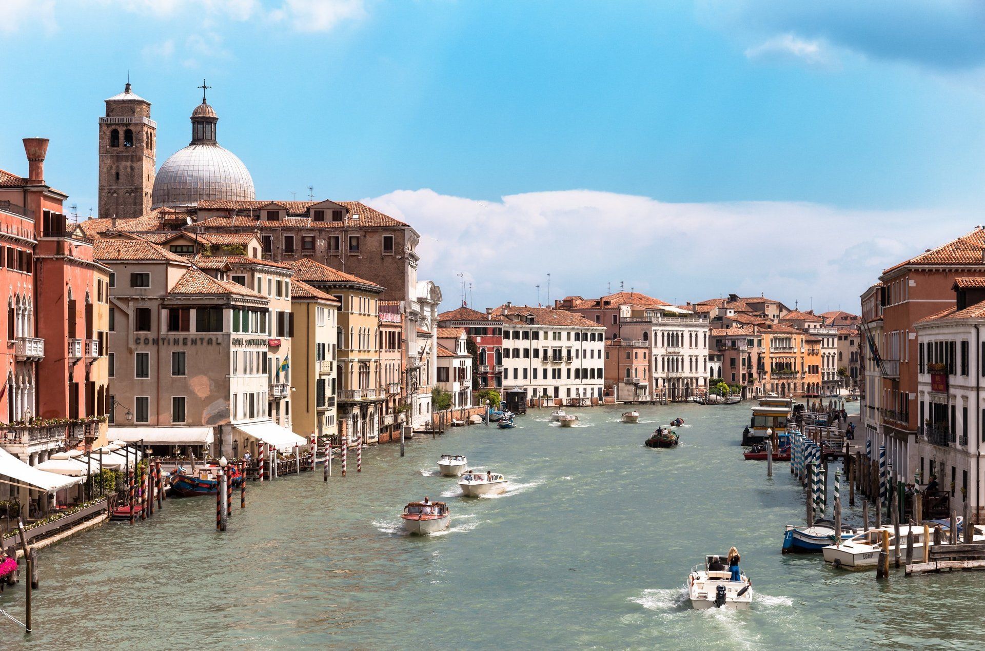 A large body of water surrounded by buildings and boats