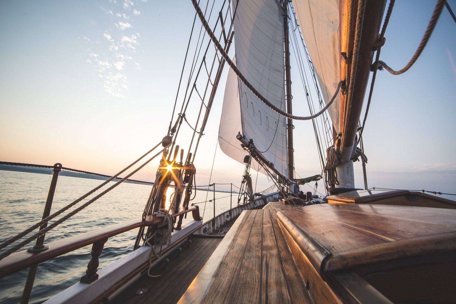 A sailboat is floating on top of a body of water.
