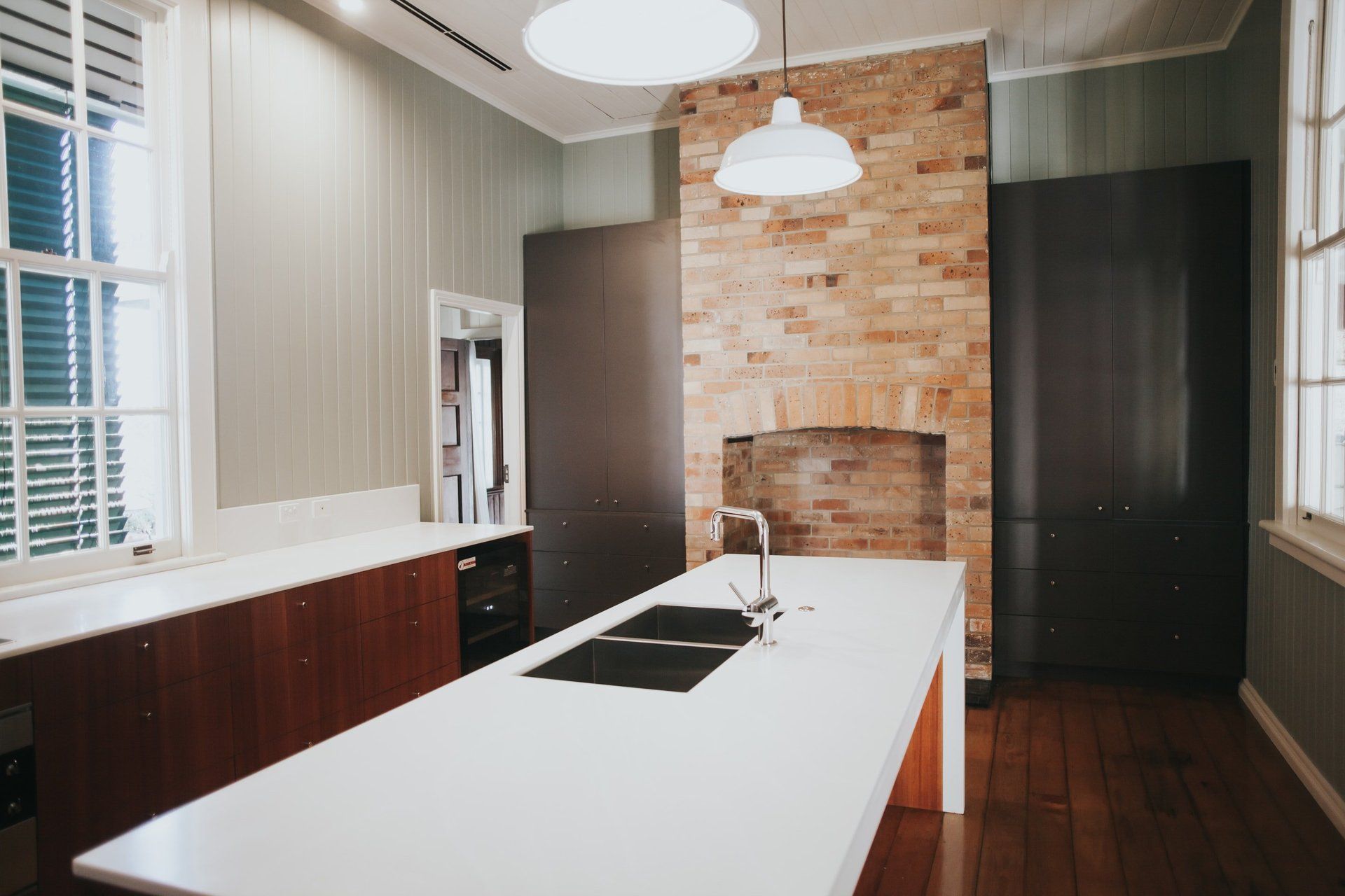There is a large island in the middle of the kitchen.