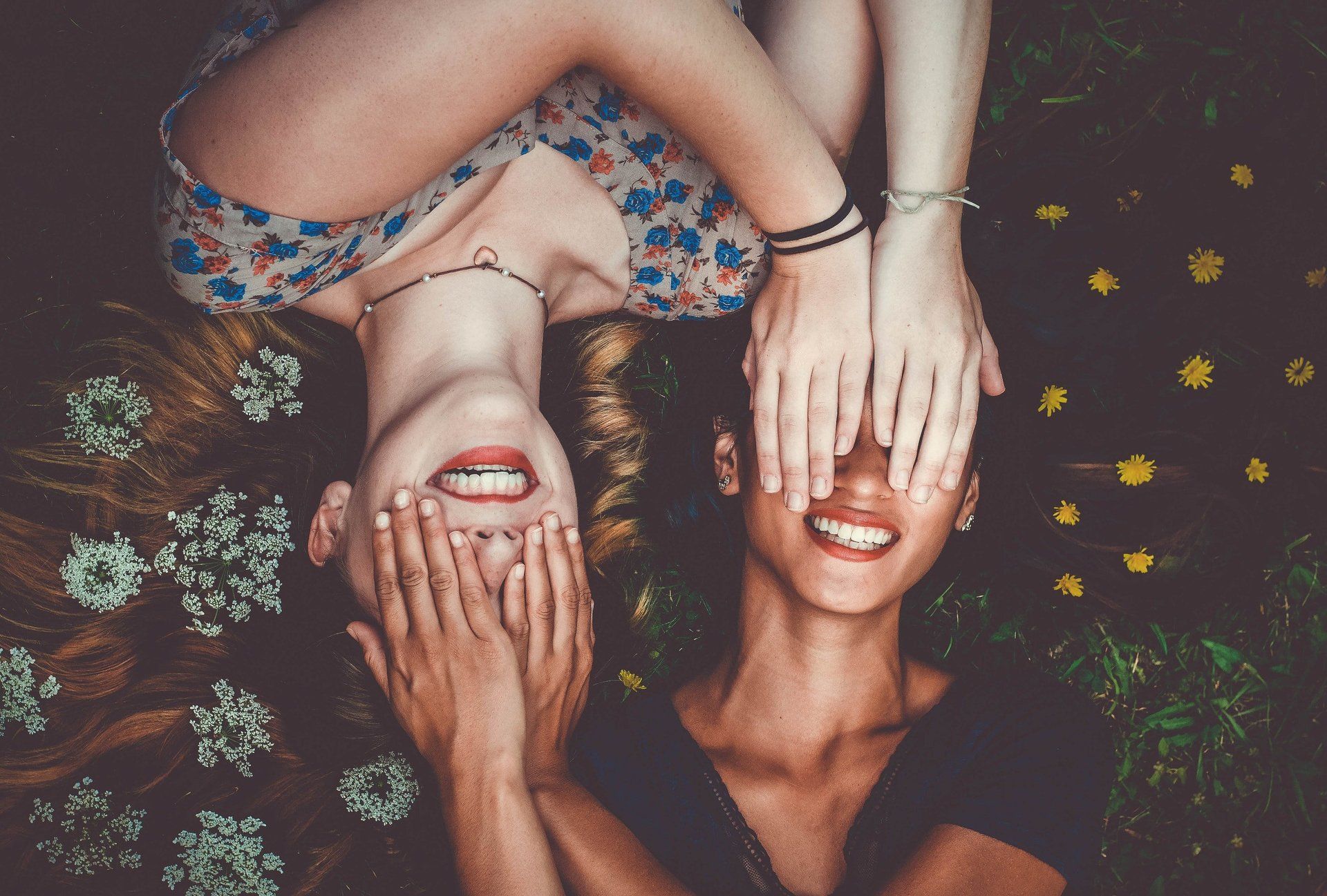 Smiling friends covering their eyes having fun | Family Dentist for Teeth Cleaning, Veneers, Whitening | Lawrence KS 66049