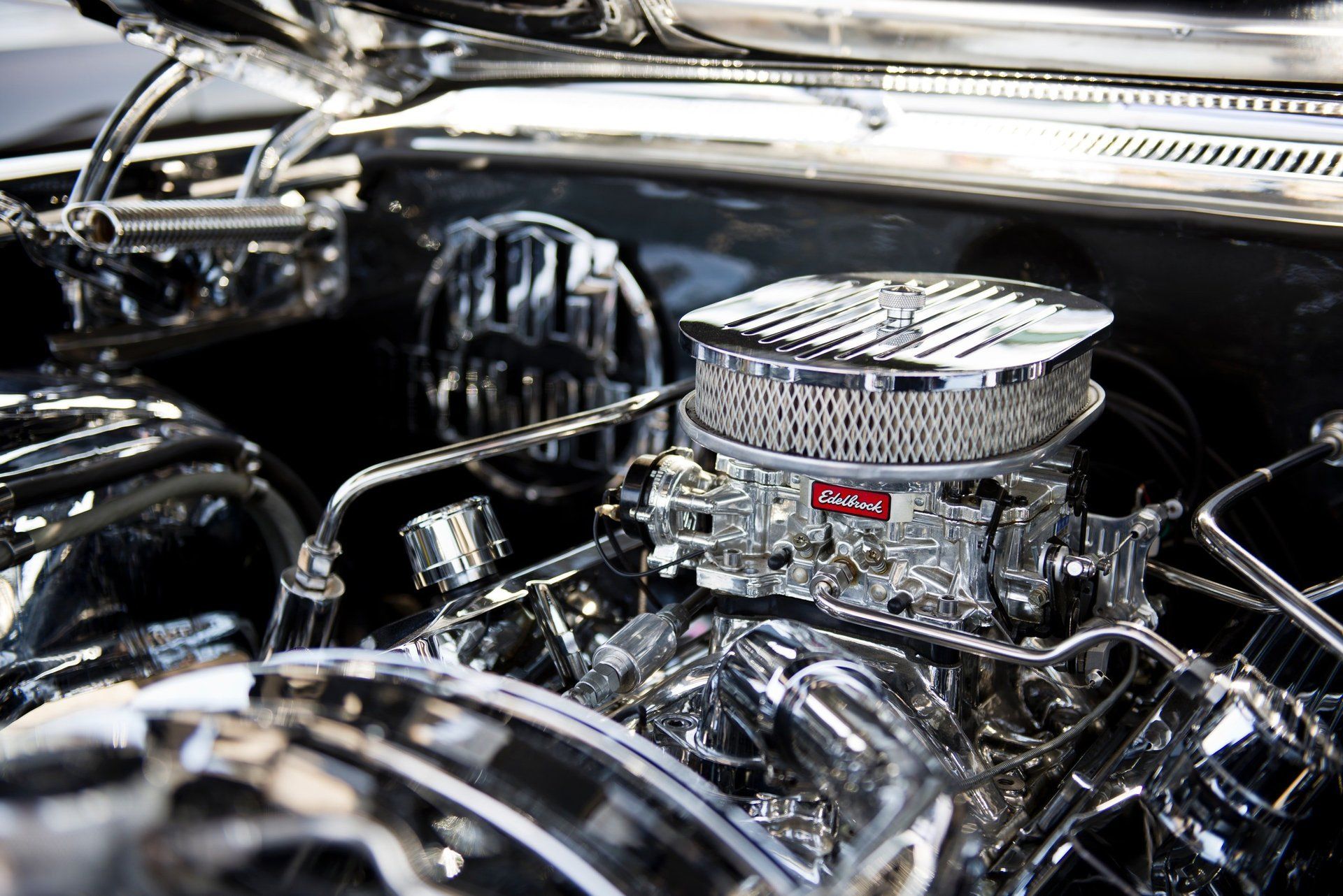 A close up of a chrome engine in a car