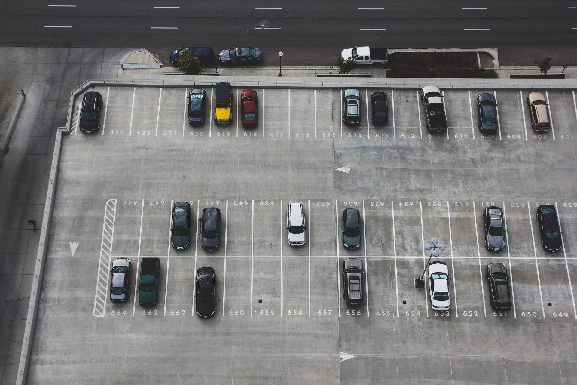 A lot of cars are parked in a parking lot