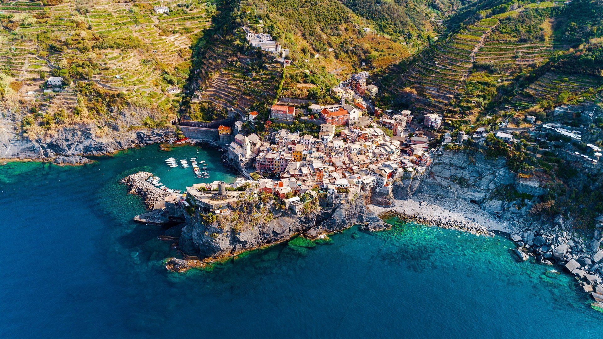 An aerial view of a small town in the middle of the ocean.