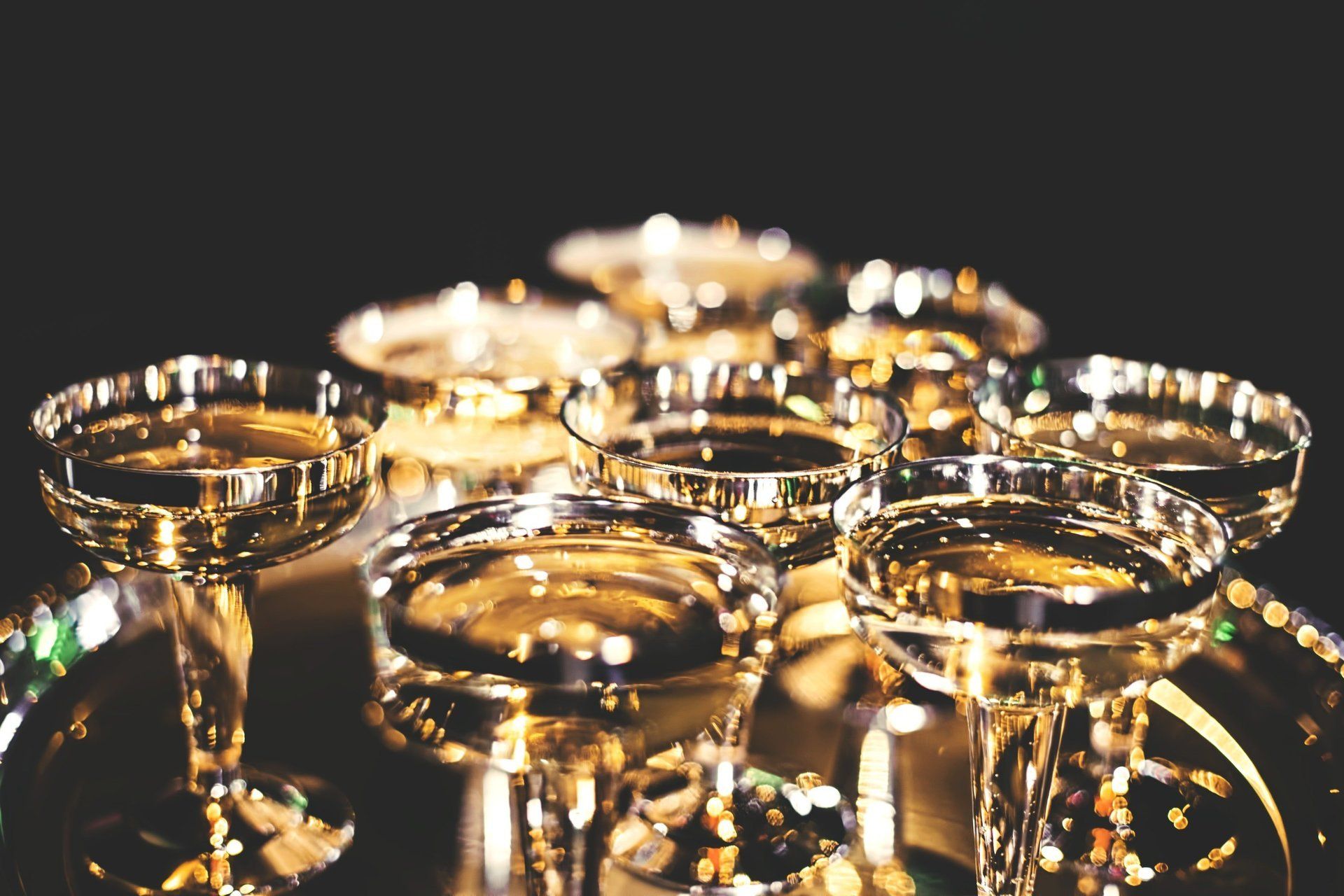 Champagne glasses glow under golden lights at Marina Del Rey’s New Year’s Eve 2026 gala in NYC