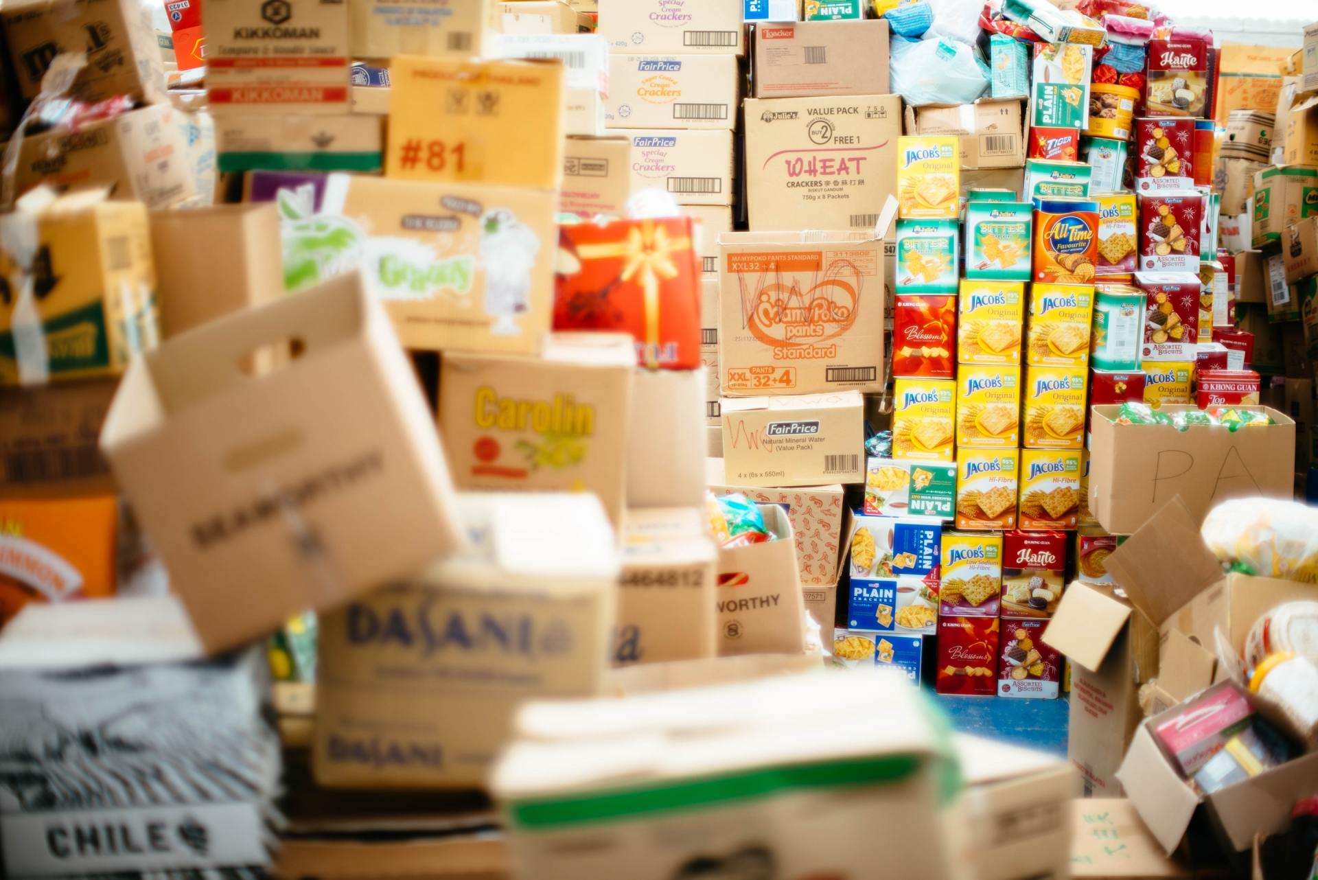 A bunch of boxes are stacked on top of each other in a store.