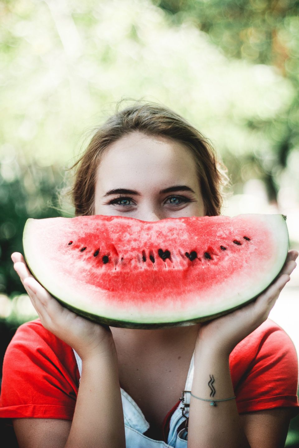 Woman with a slice of watermelon