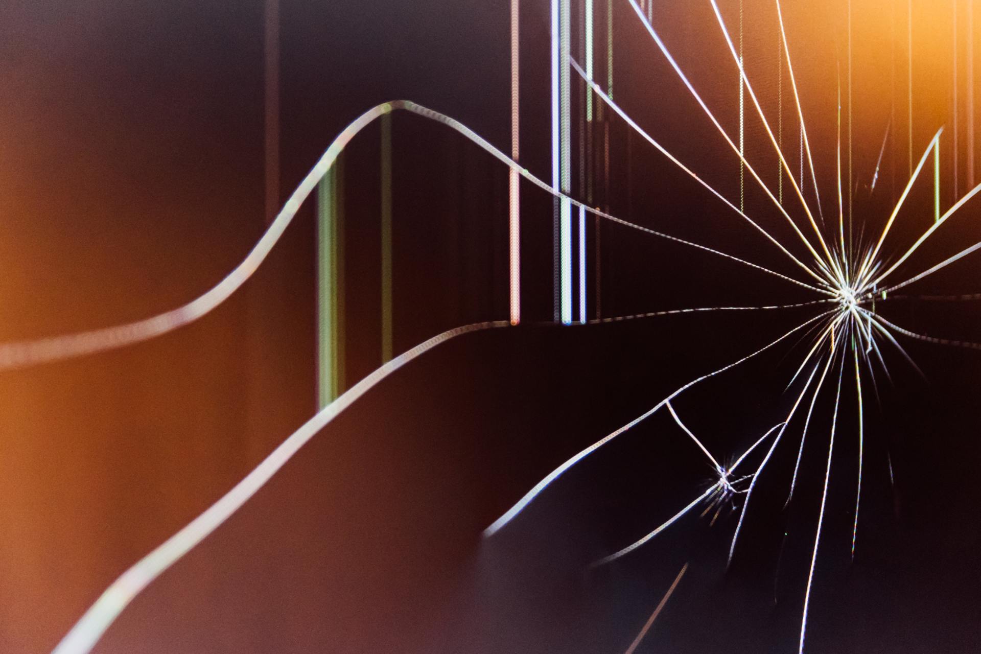 A close up of a broken glass screen