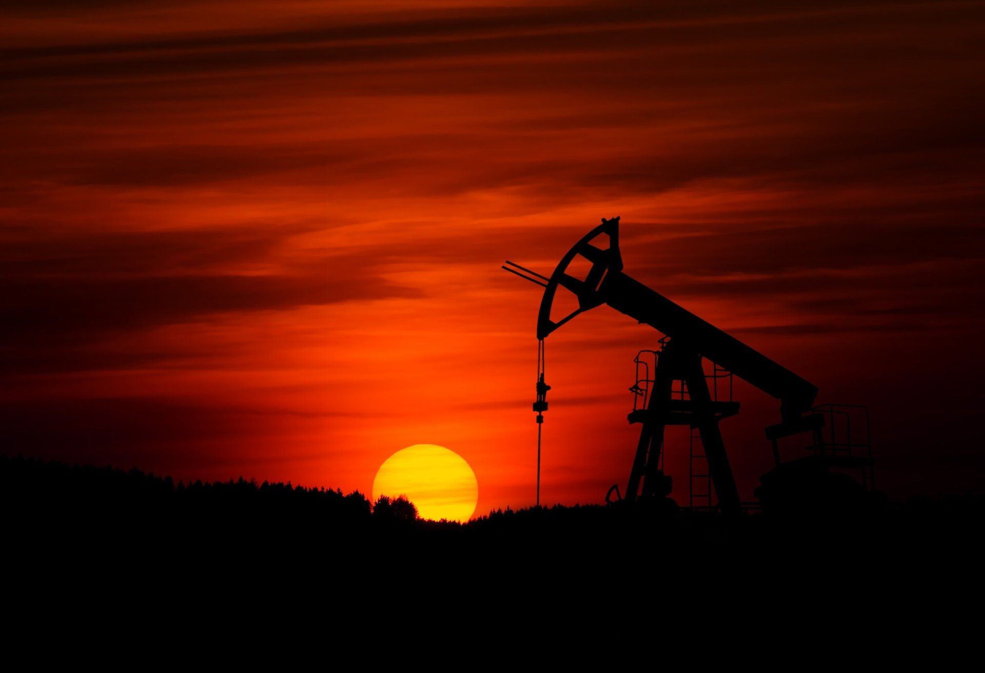 sunset image of an oil and gas refinery