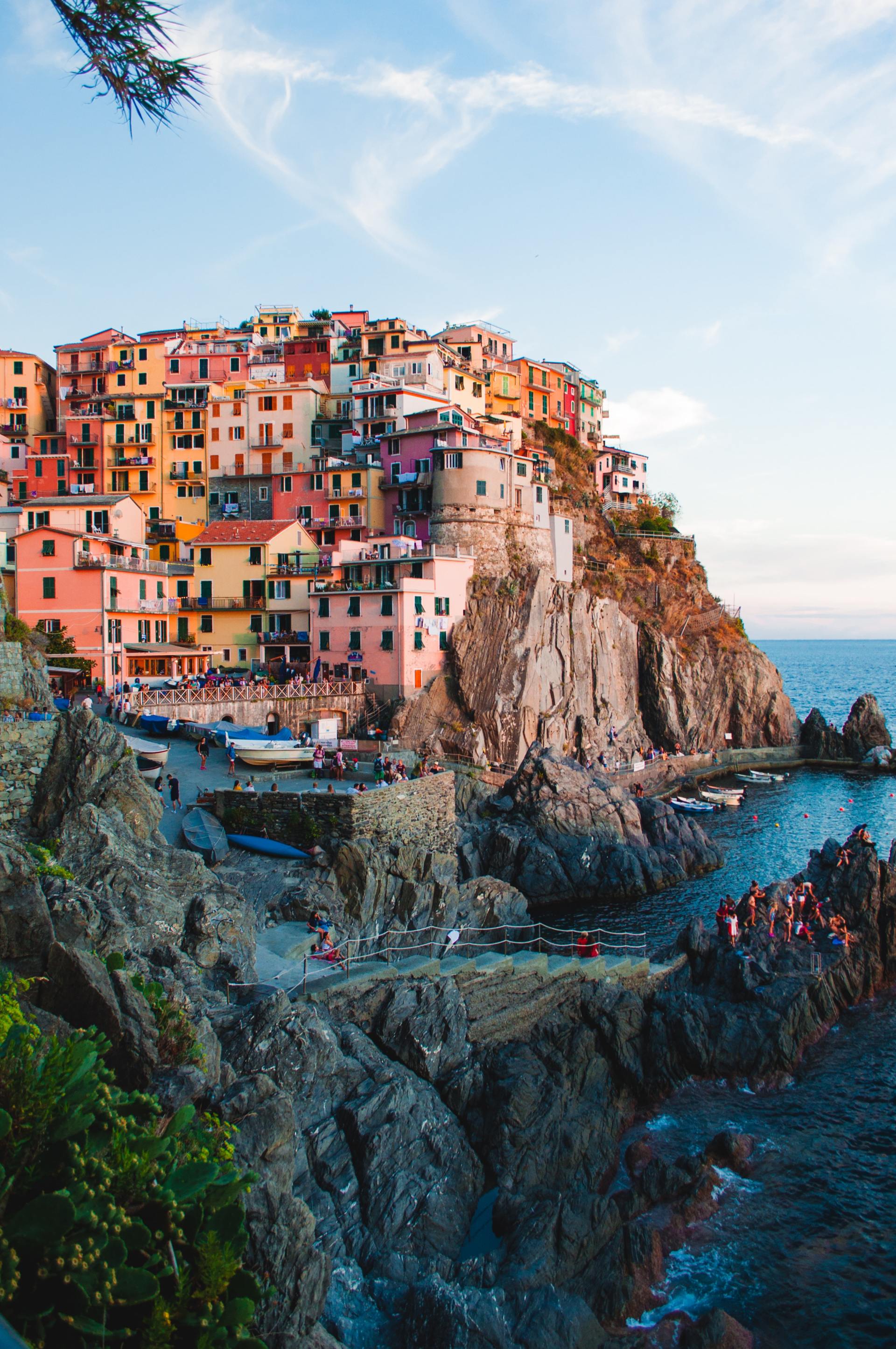 A small town on top of a cliff overlooking the ocean.