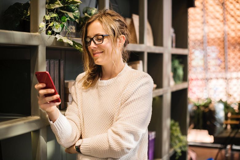 woman reading on smartphone