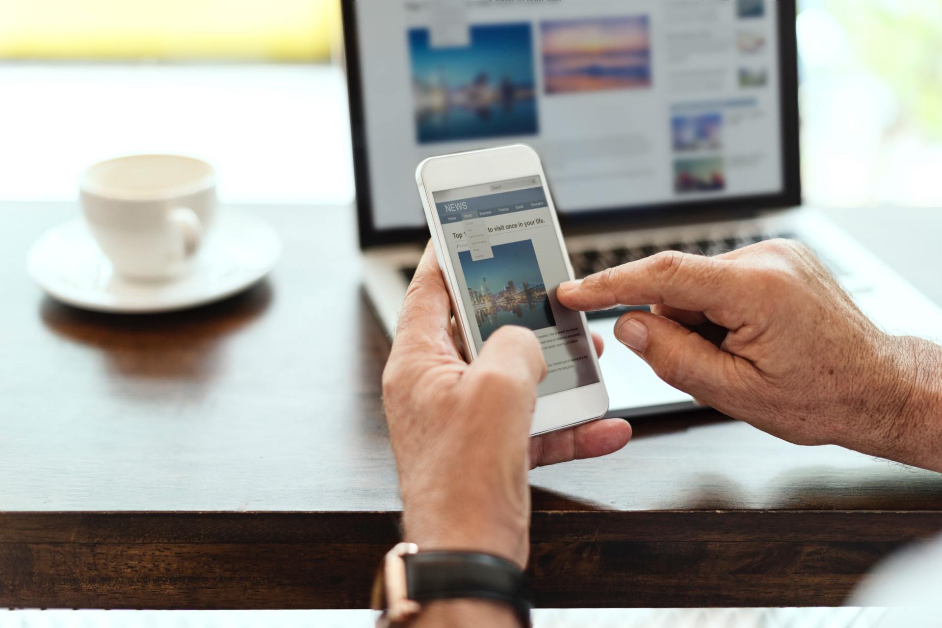 surfing web with mobile phone / laptop