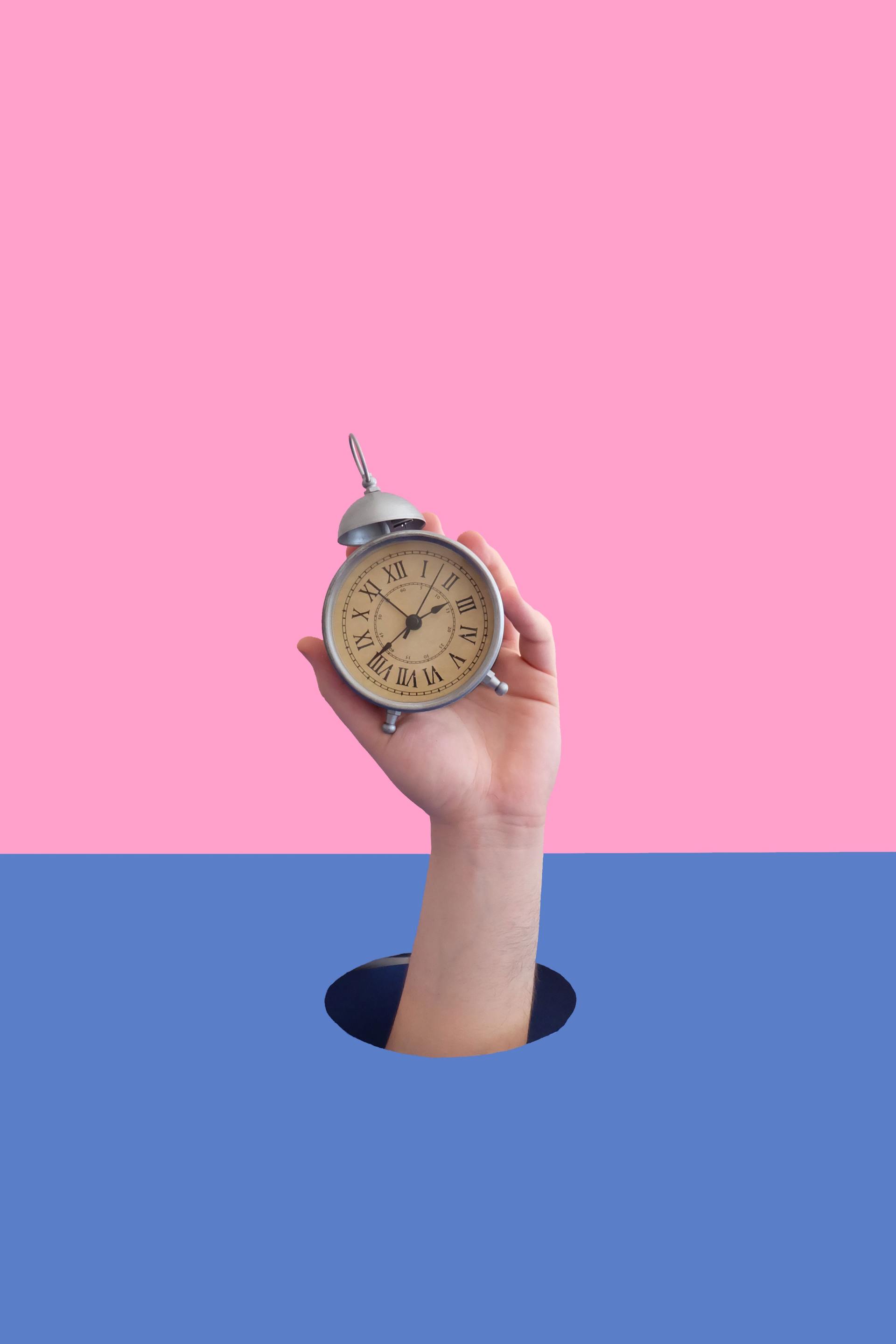hand holding a watch reminds of us value of time