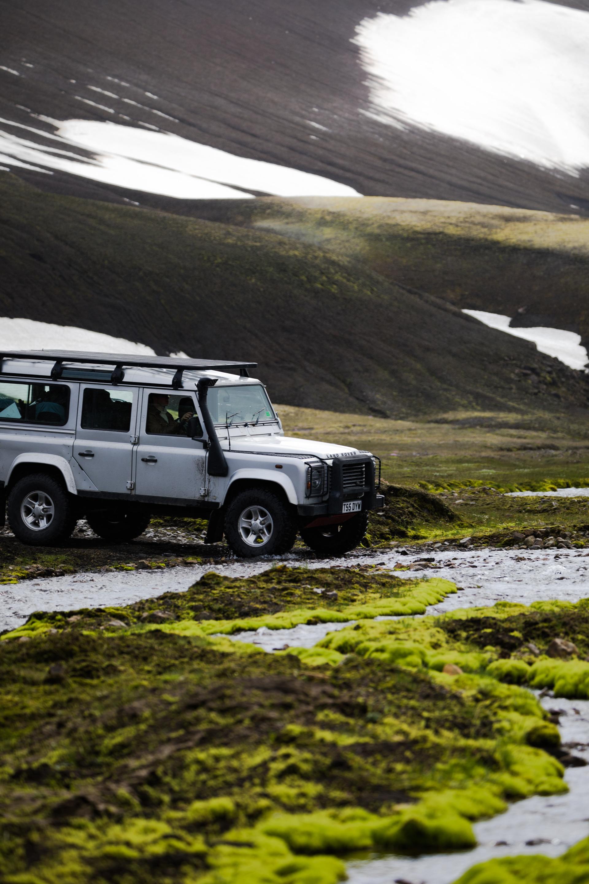 Overland vehicle in mountain snow