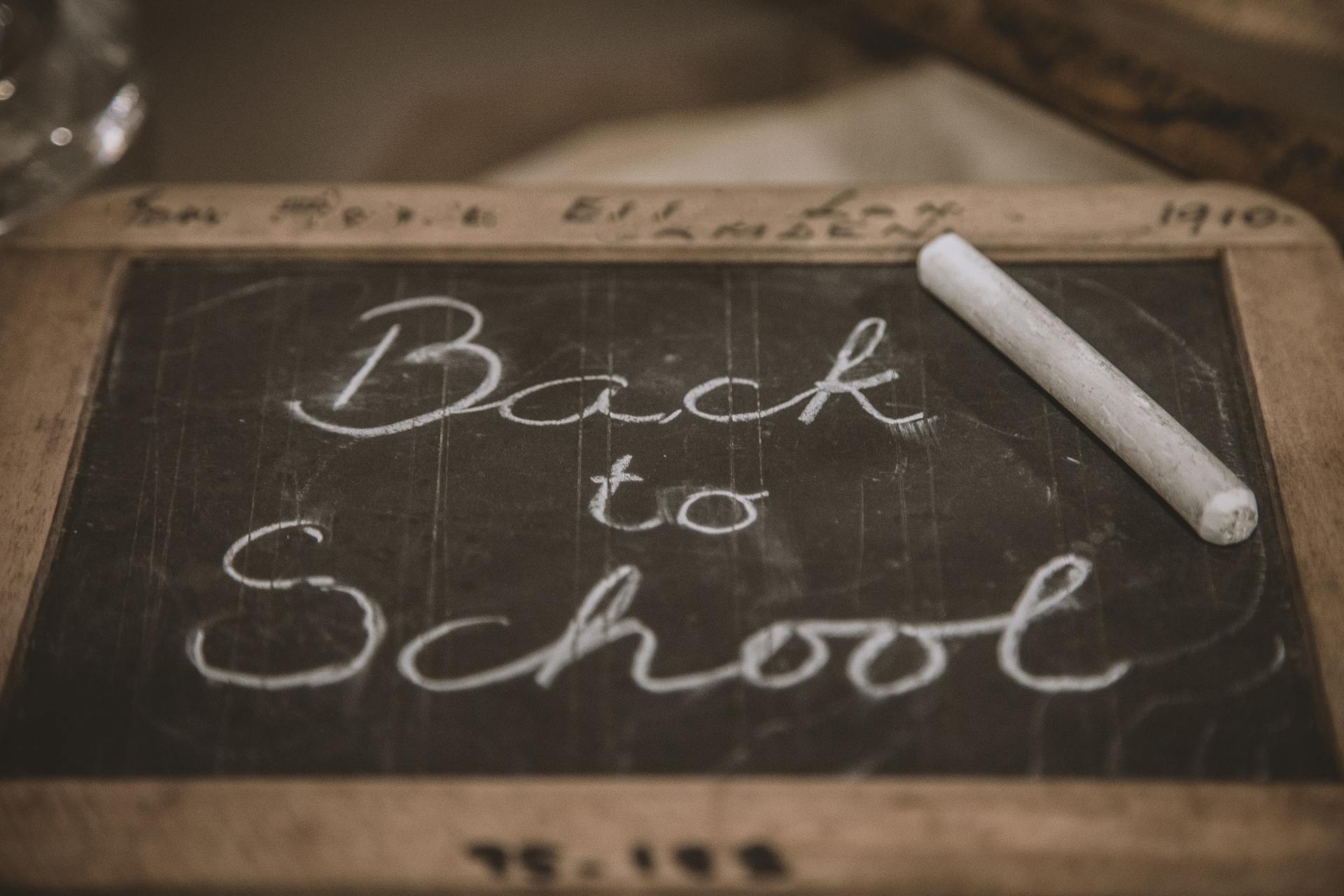 a chalkboard with the words back to school written on it