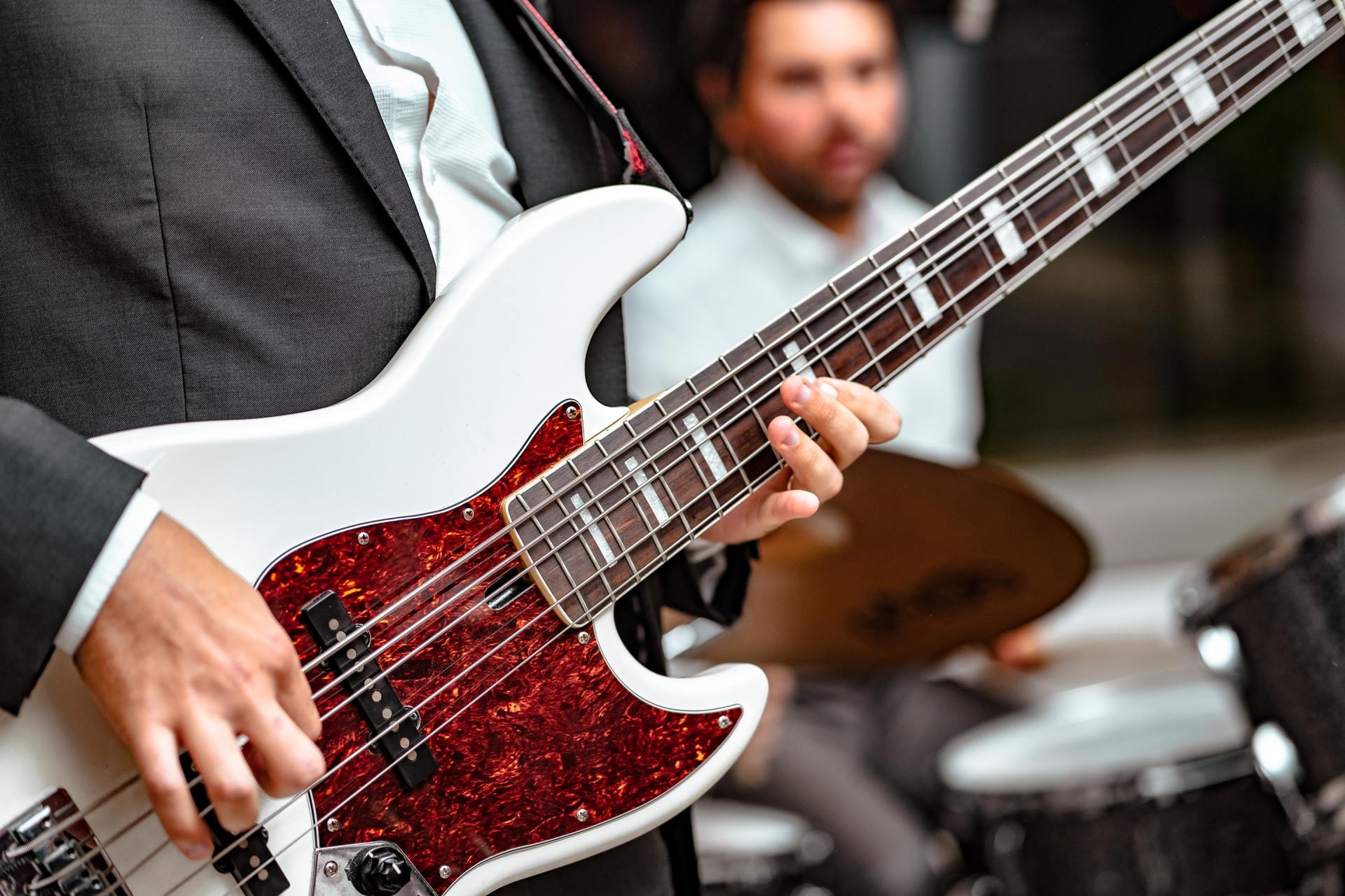 male playing an electric guitar