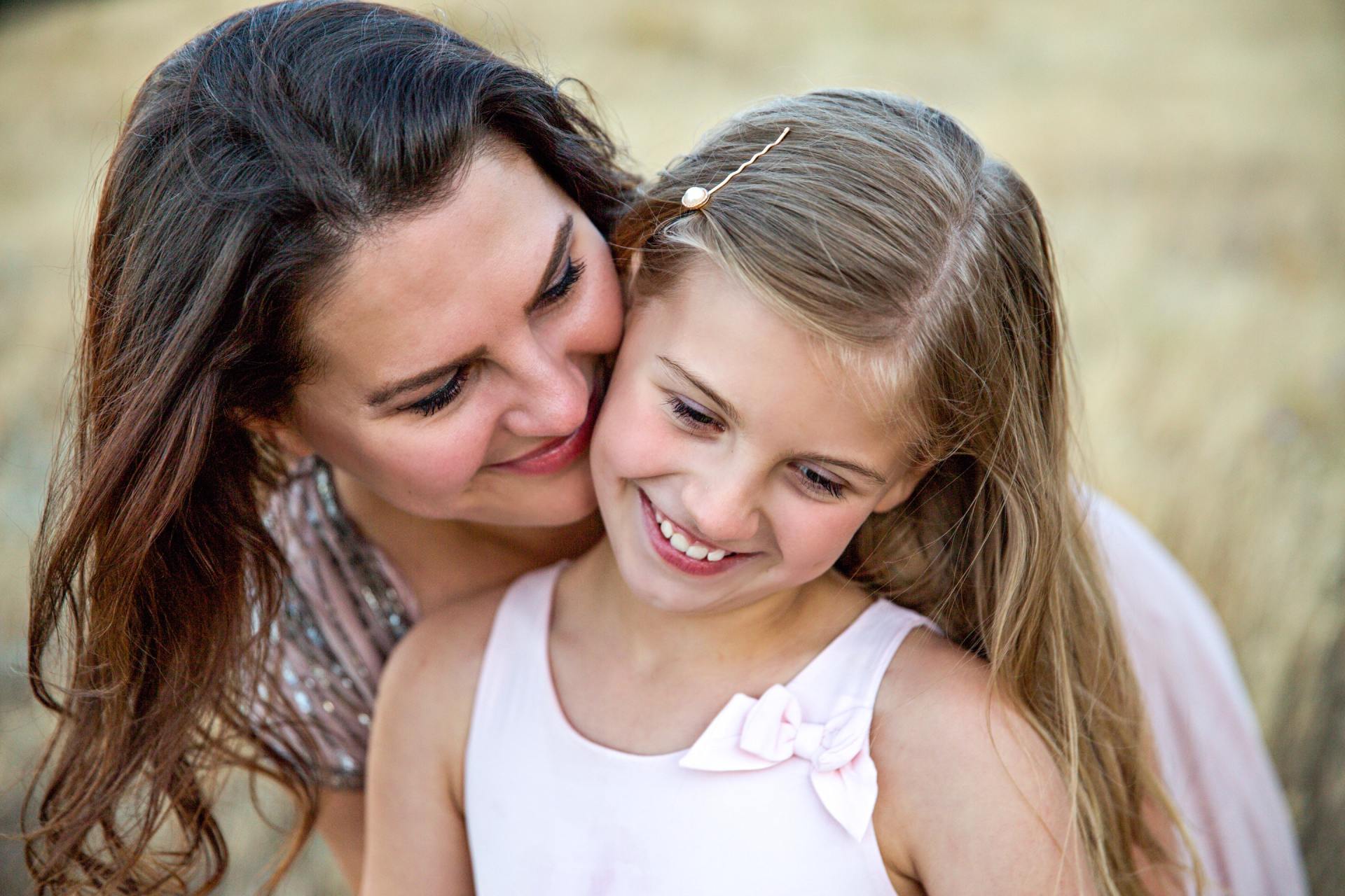Mother and daughter smiling