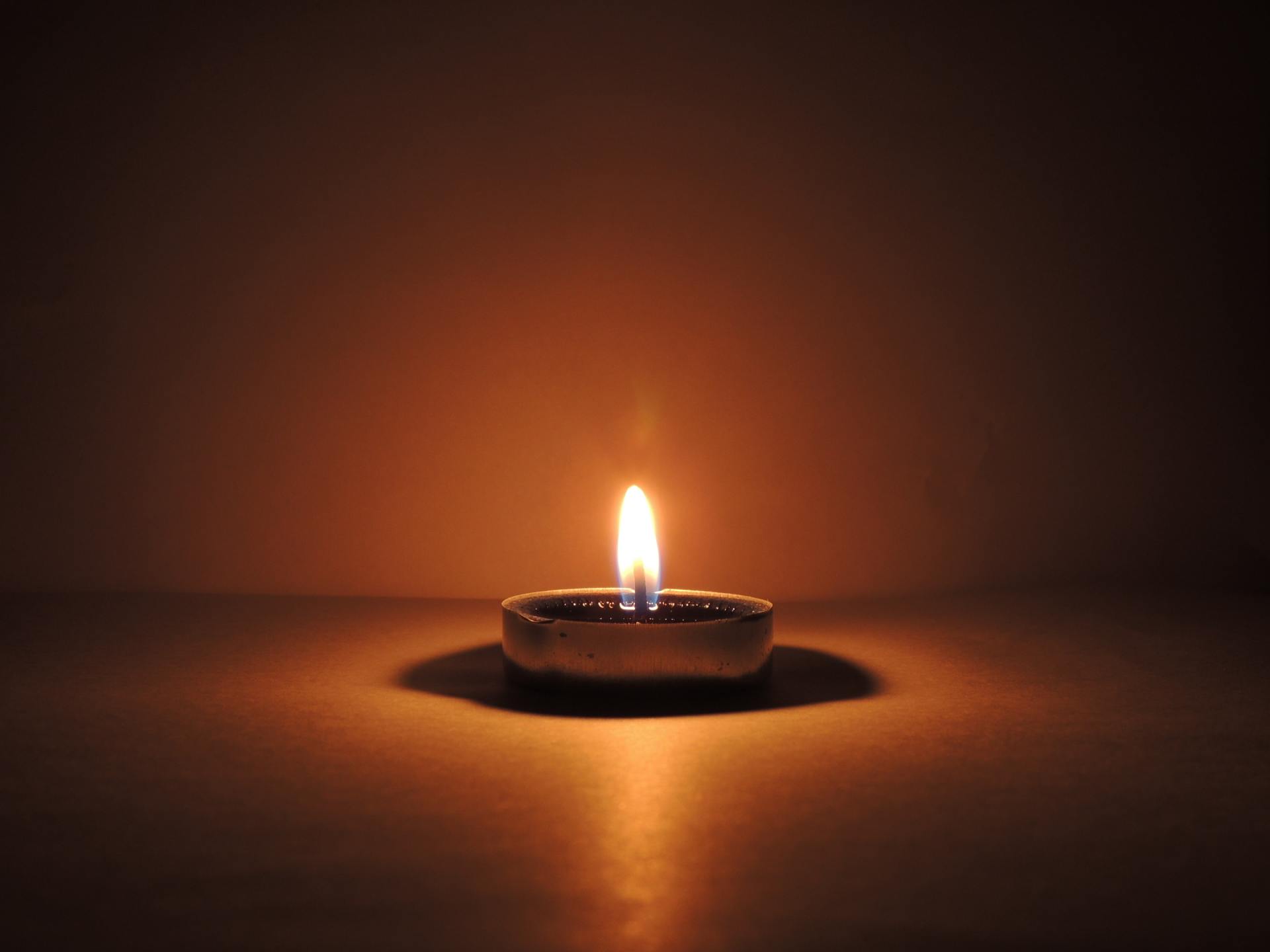 A photo of a small lit candle