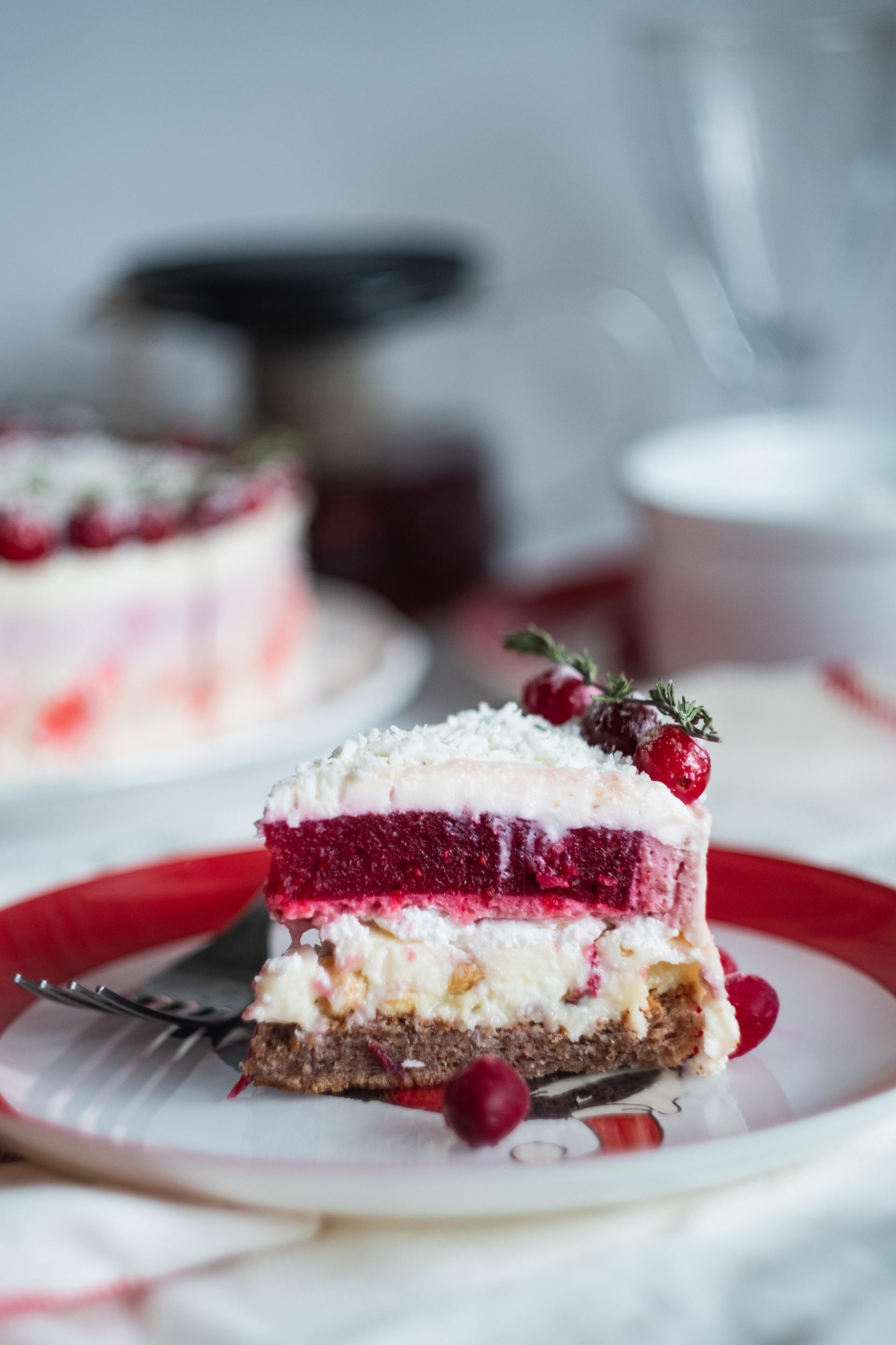 A slice of cake is on a plate with a fork.