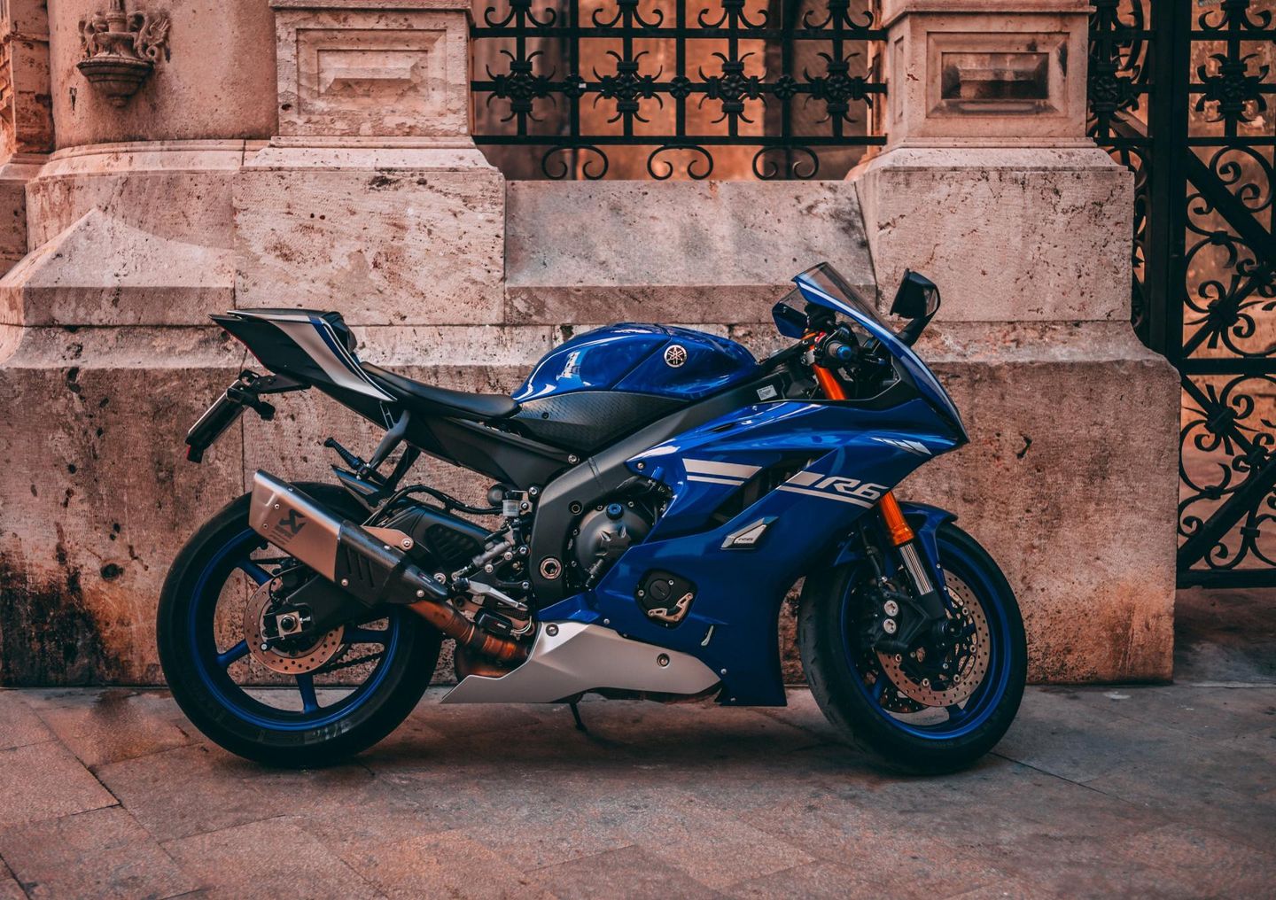 motorcycle under fence
