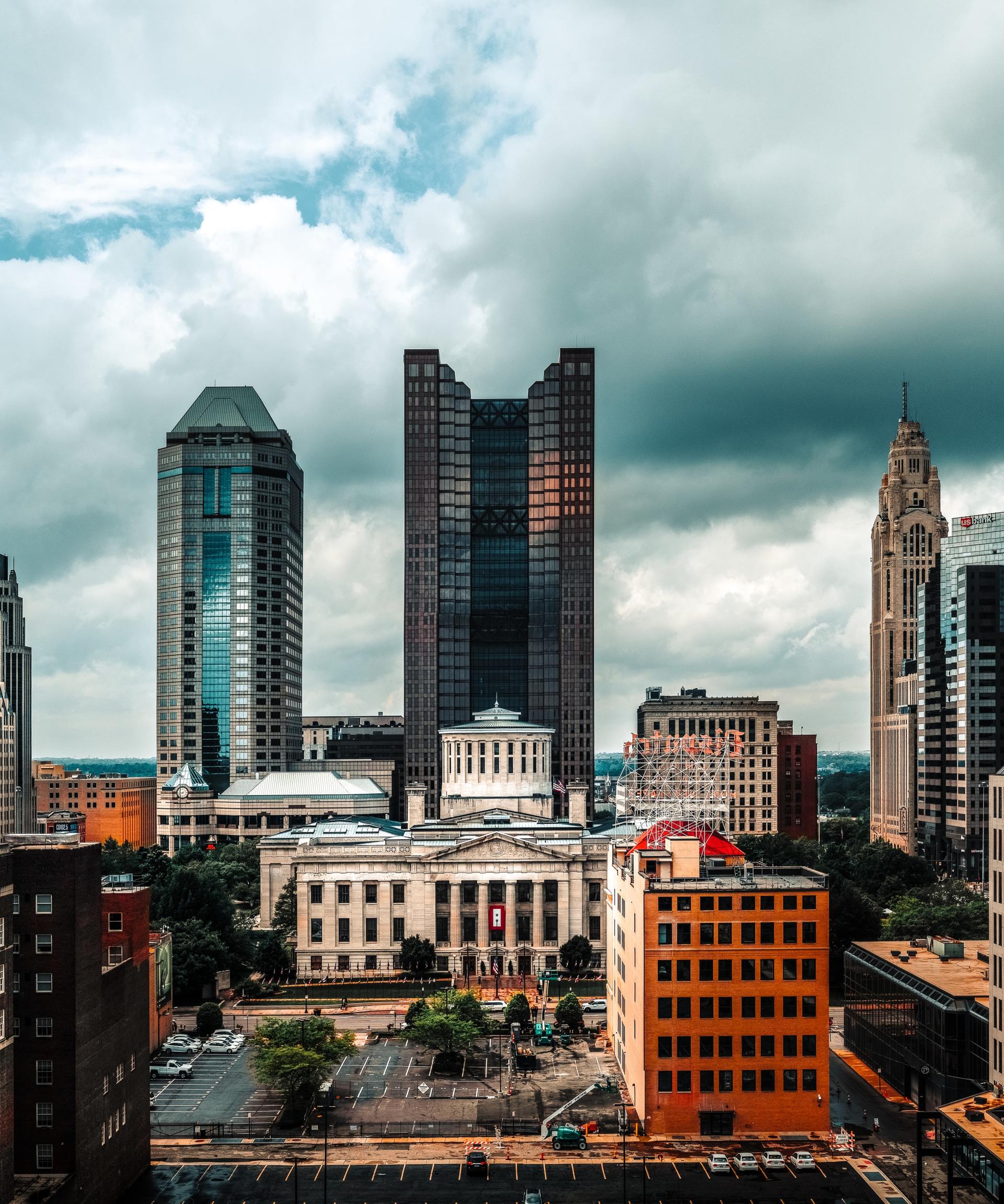An aerial view of a city with a cloudy sky
