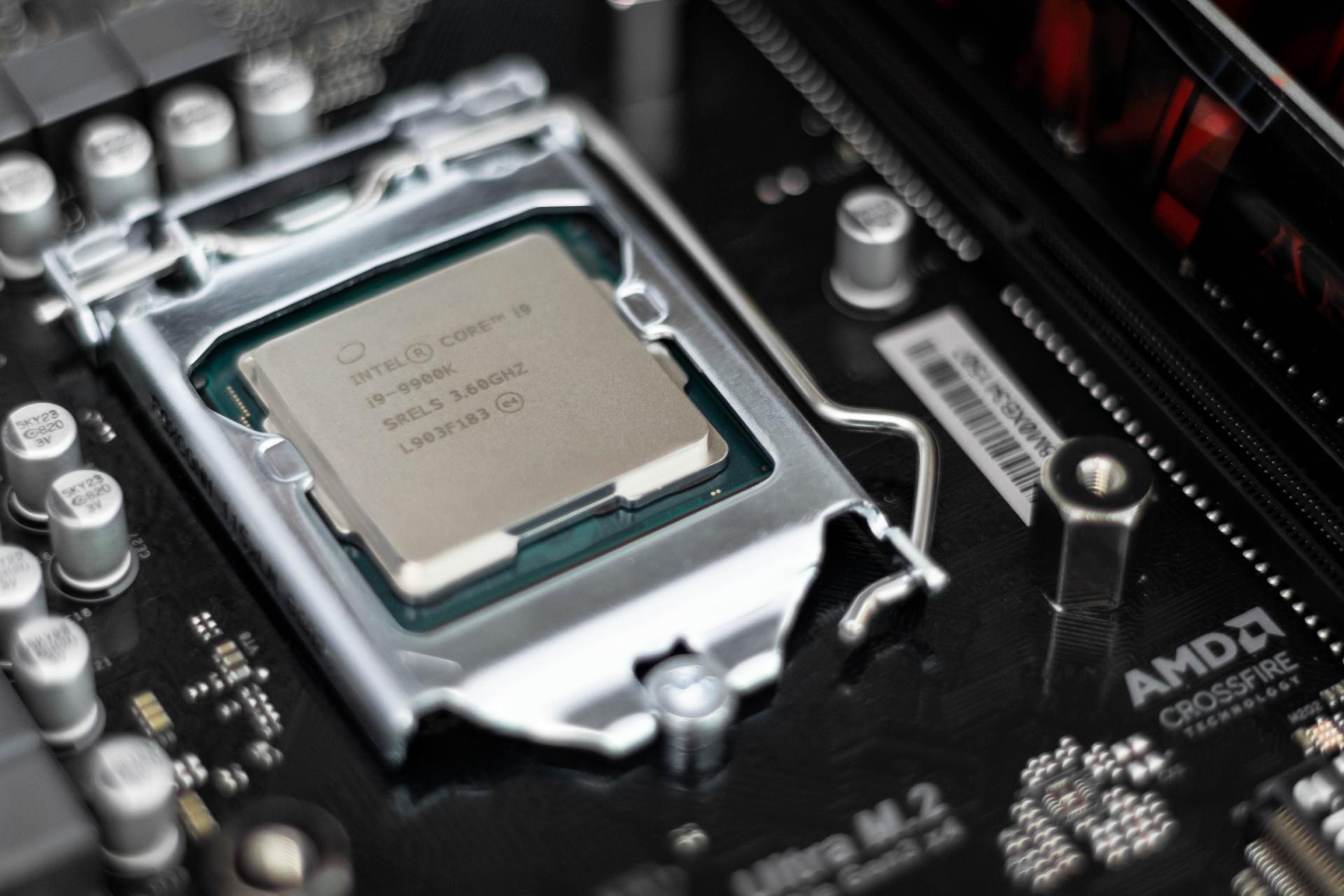 A computer processor is sitting on top of a motherboard.