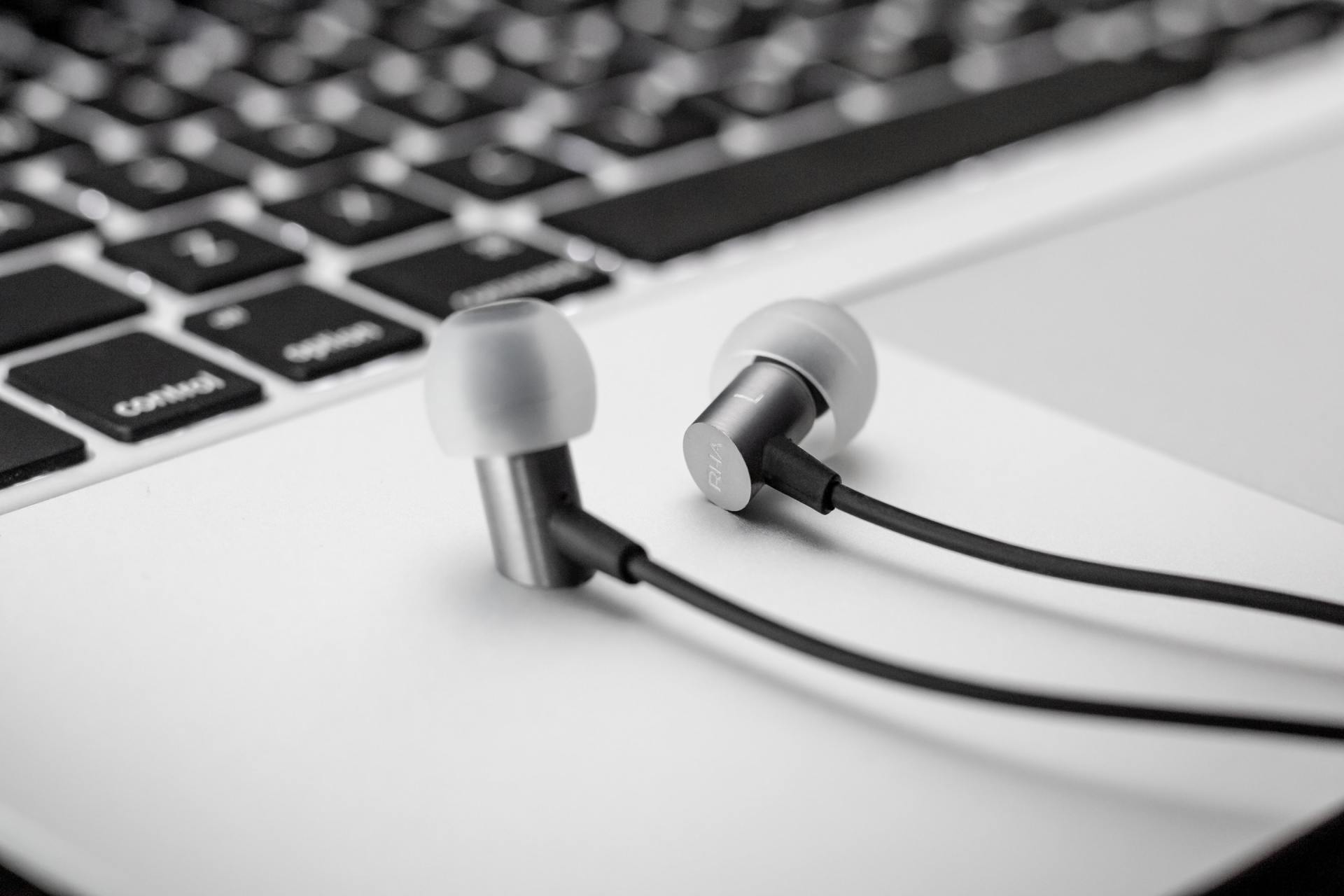 Computer with audio earbuds