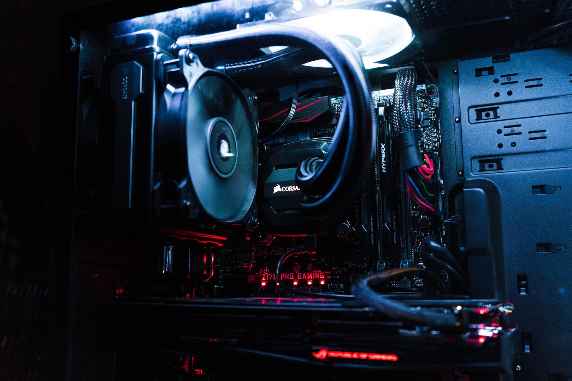 A close up of a computer with a fan on top of it.
