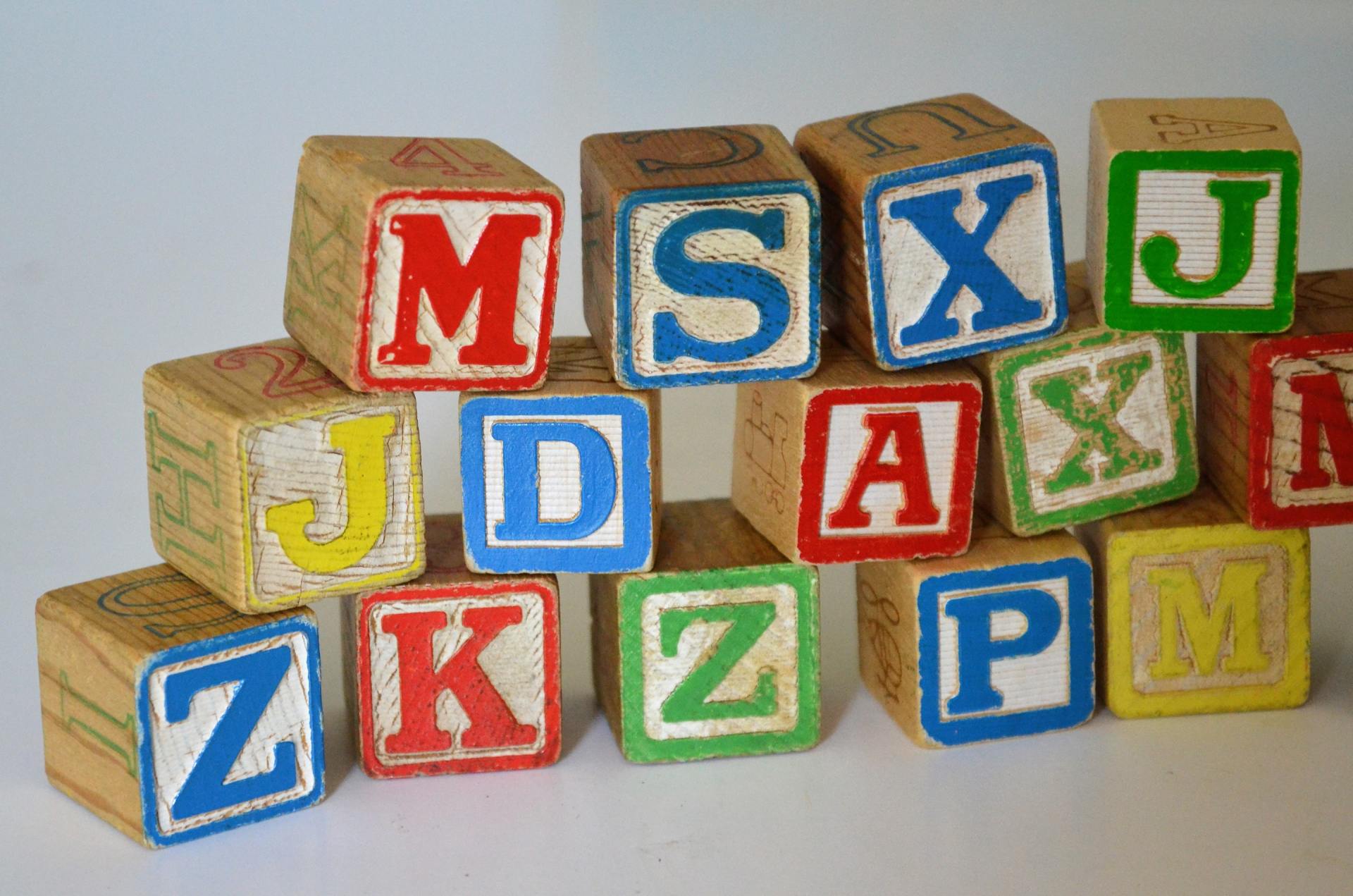 A bunch of wooden blocks with letters on them