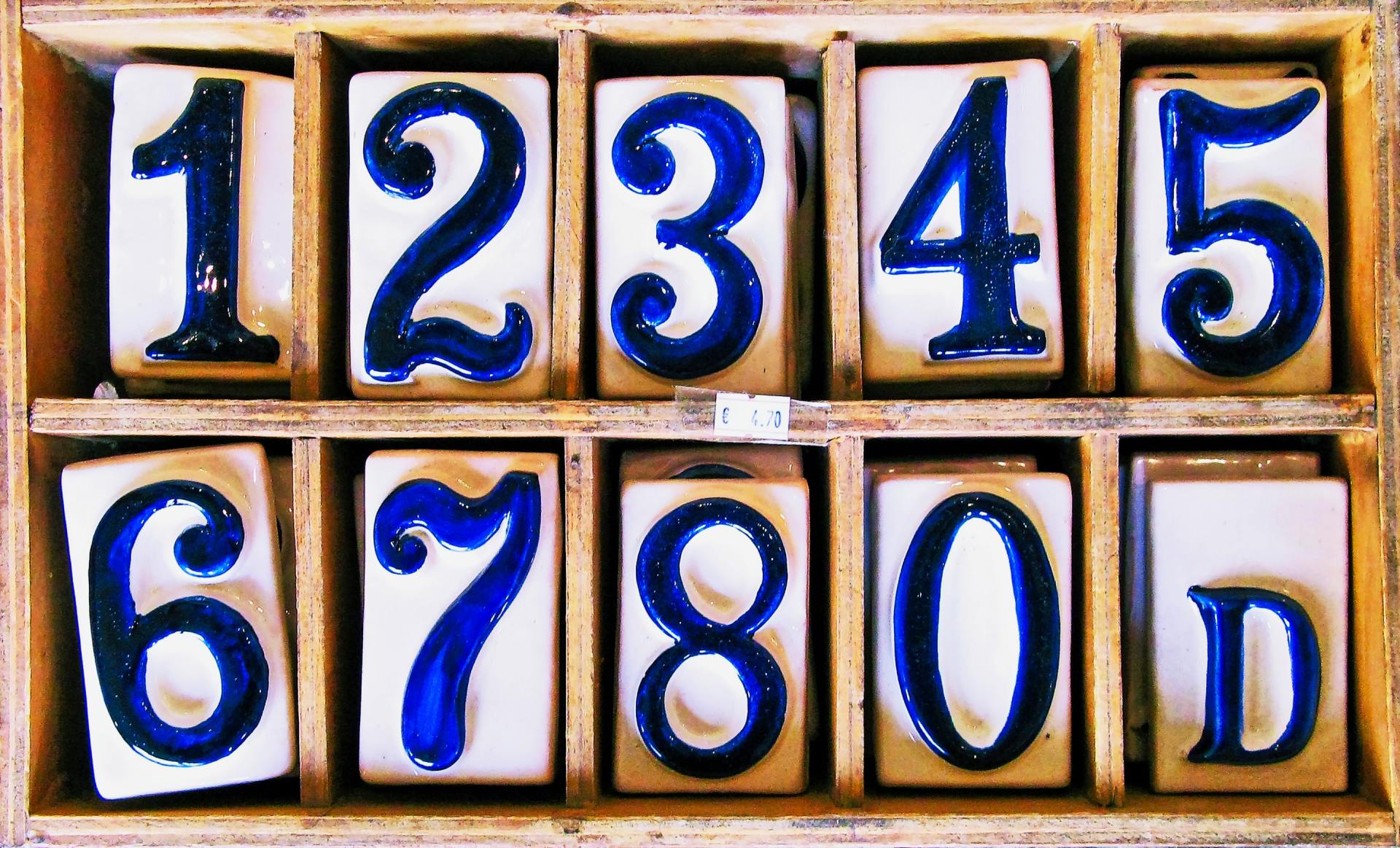 Photo of number tiles lined up in boxes