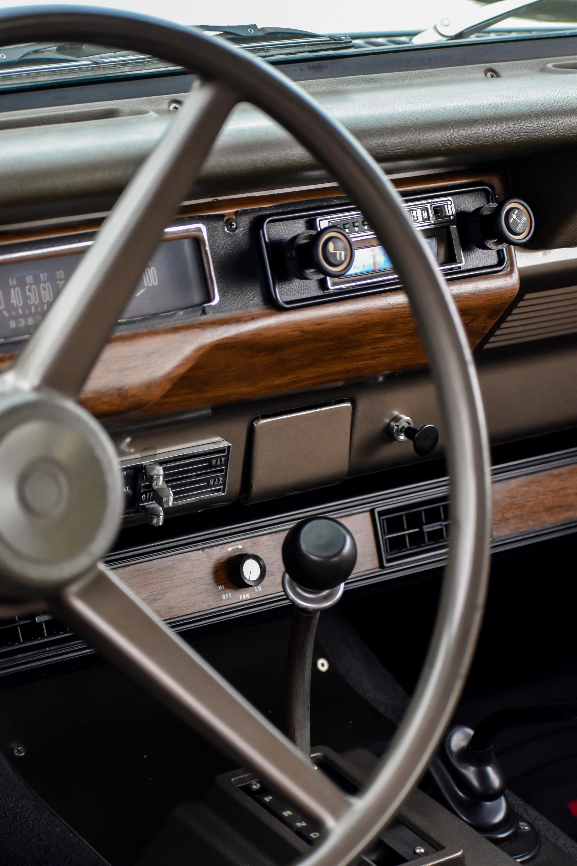 A close up of a steering wheel in a car