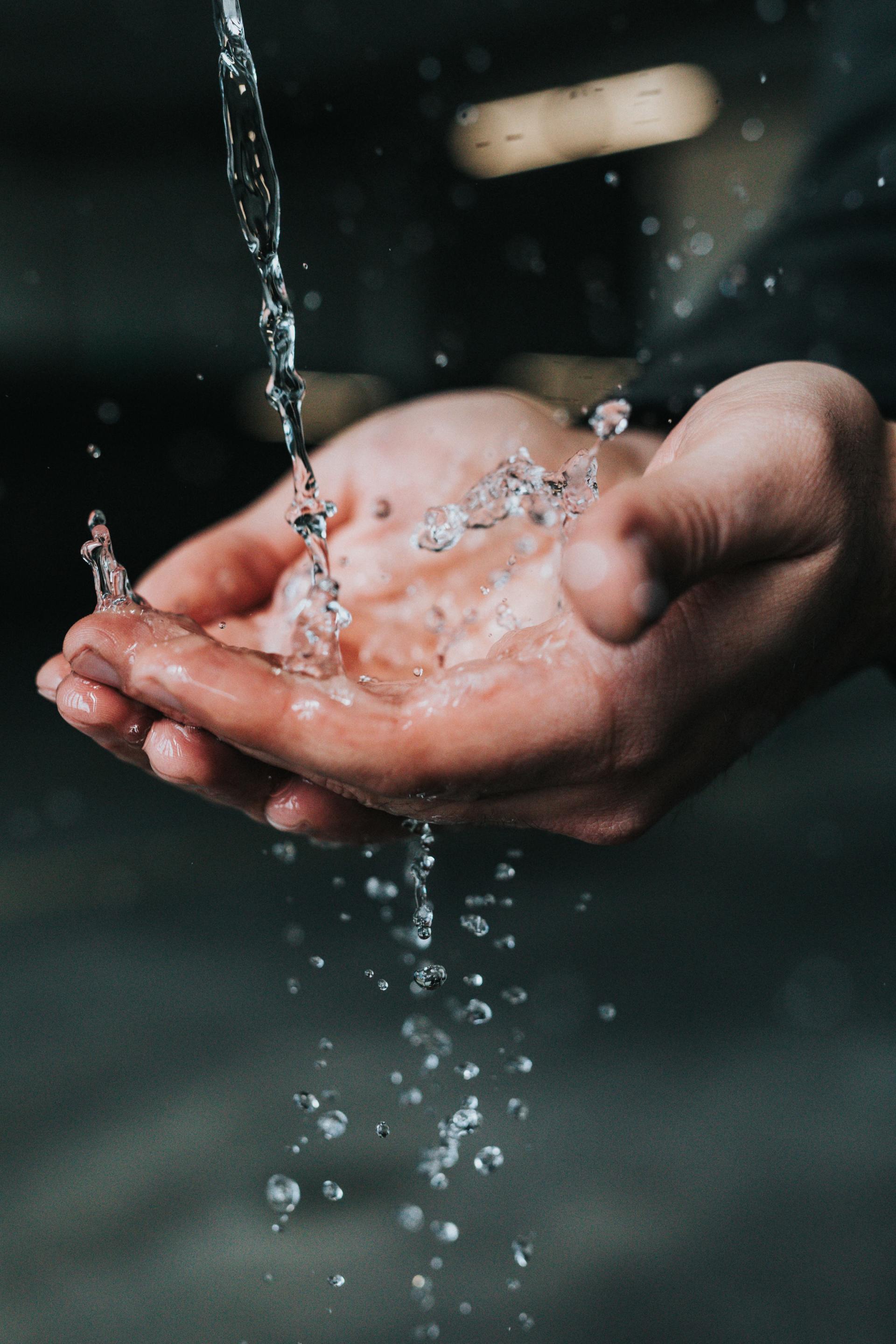 hands in water