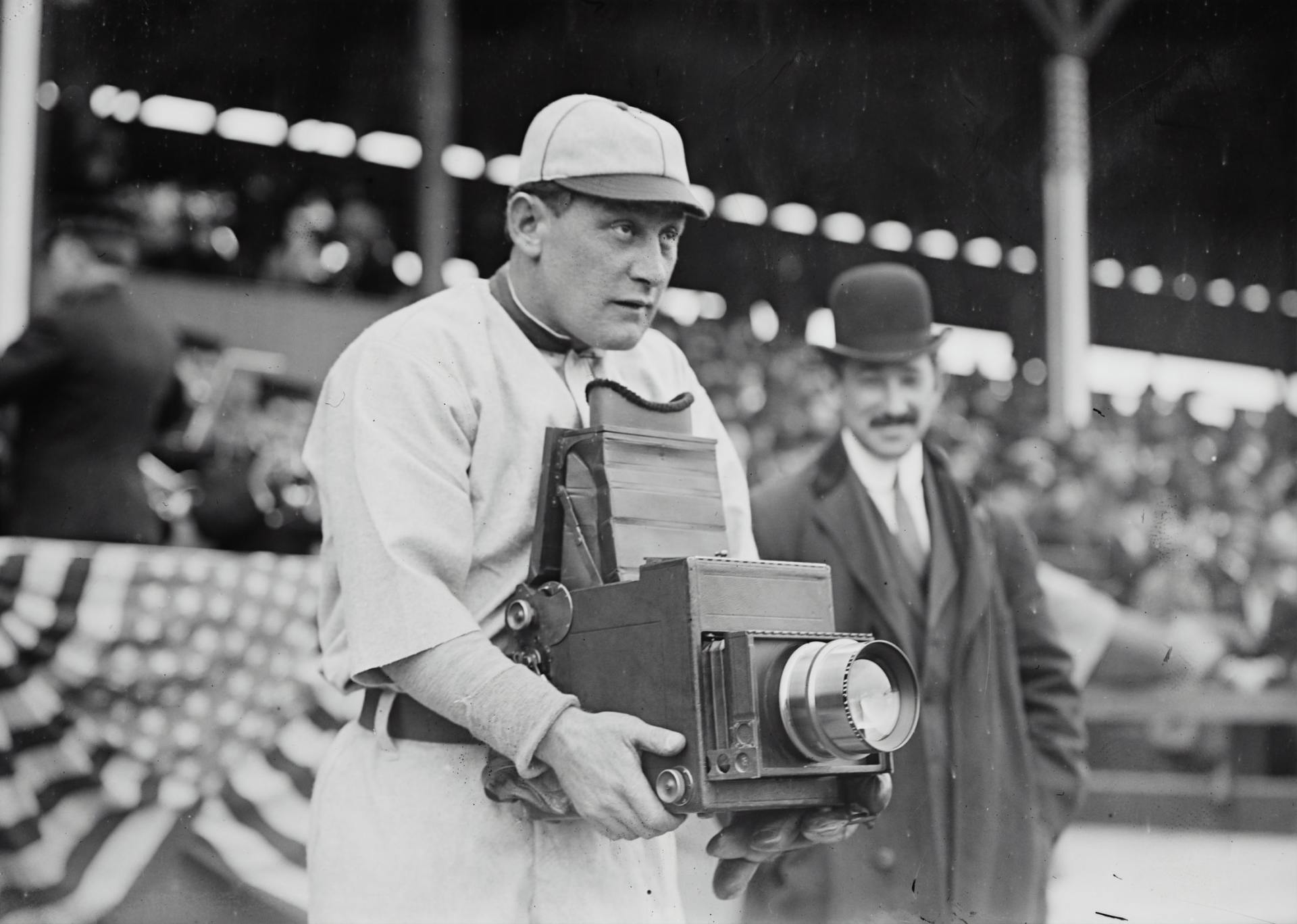 black and white photo with a large camera