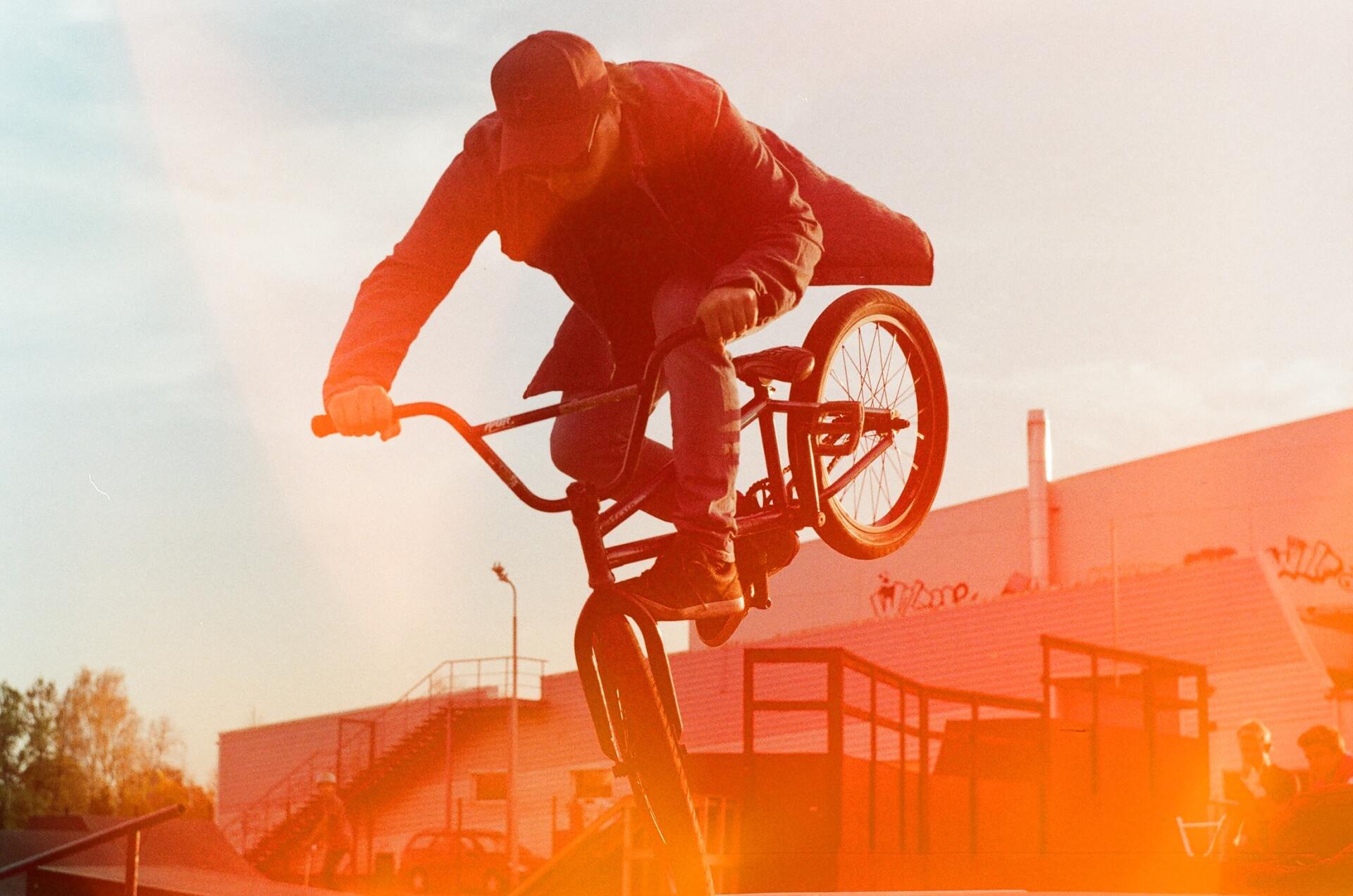 A man is doing a trick on a bmx bike.