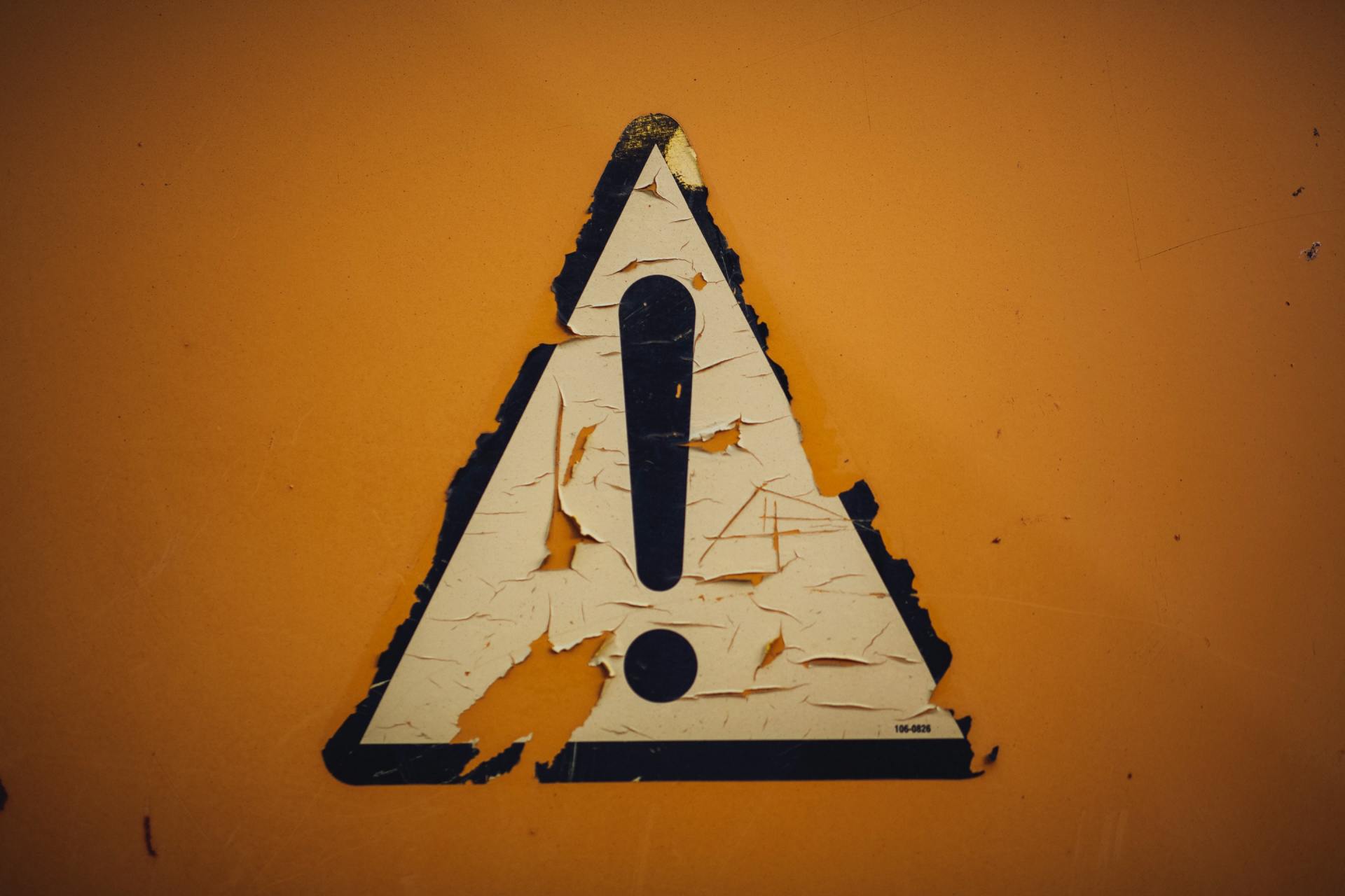 A triangle with an exclamation point inside of it