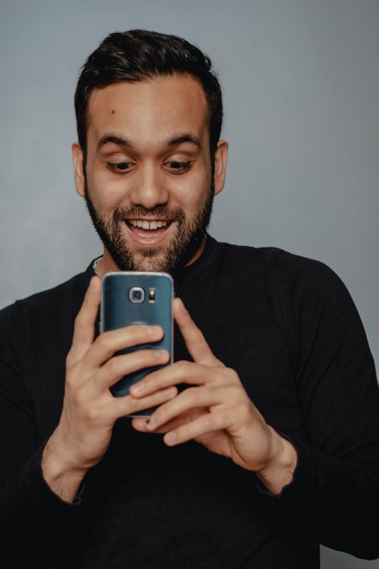 Smiling Man Texting Review PC Tablet