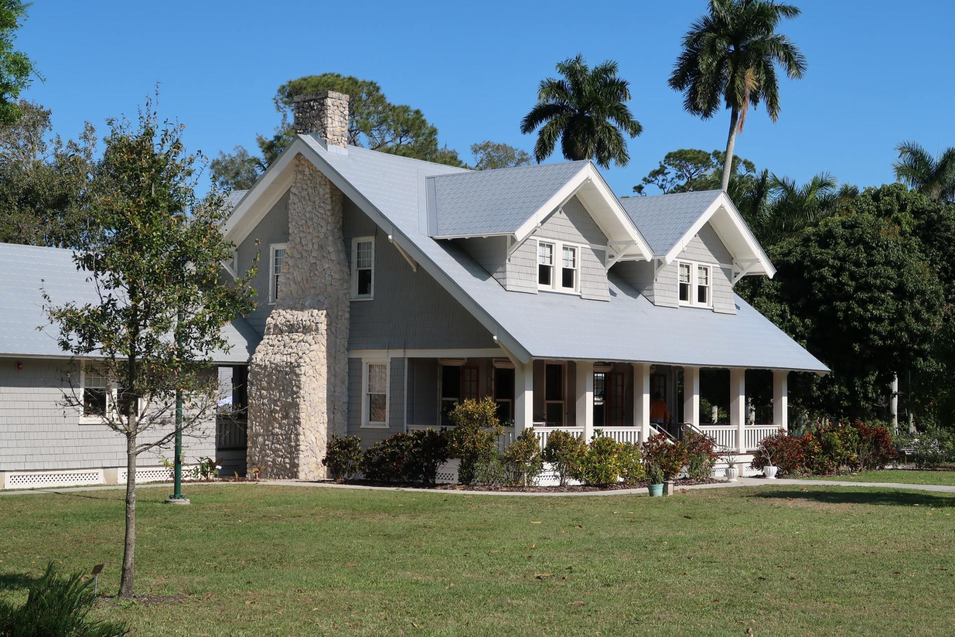 Residential Gray 2 story single family home and front yard