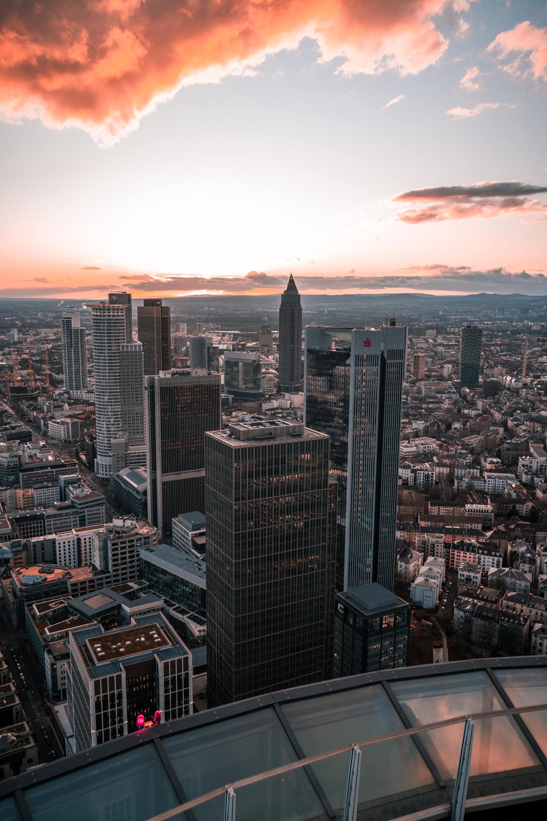 An aerial view of a city skyline at sunset.